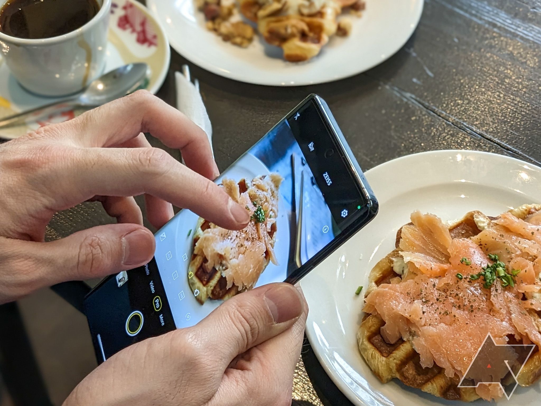 The Vivo X90 Expert taking a photo of food.