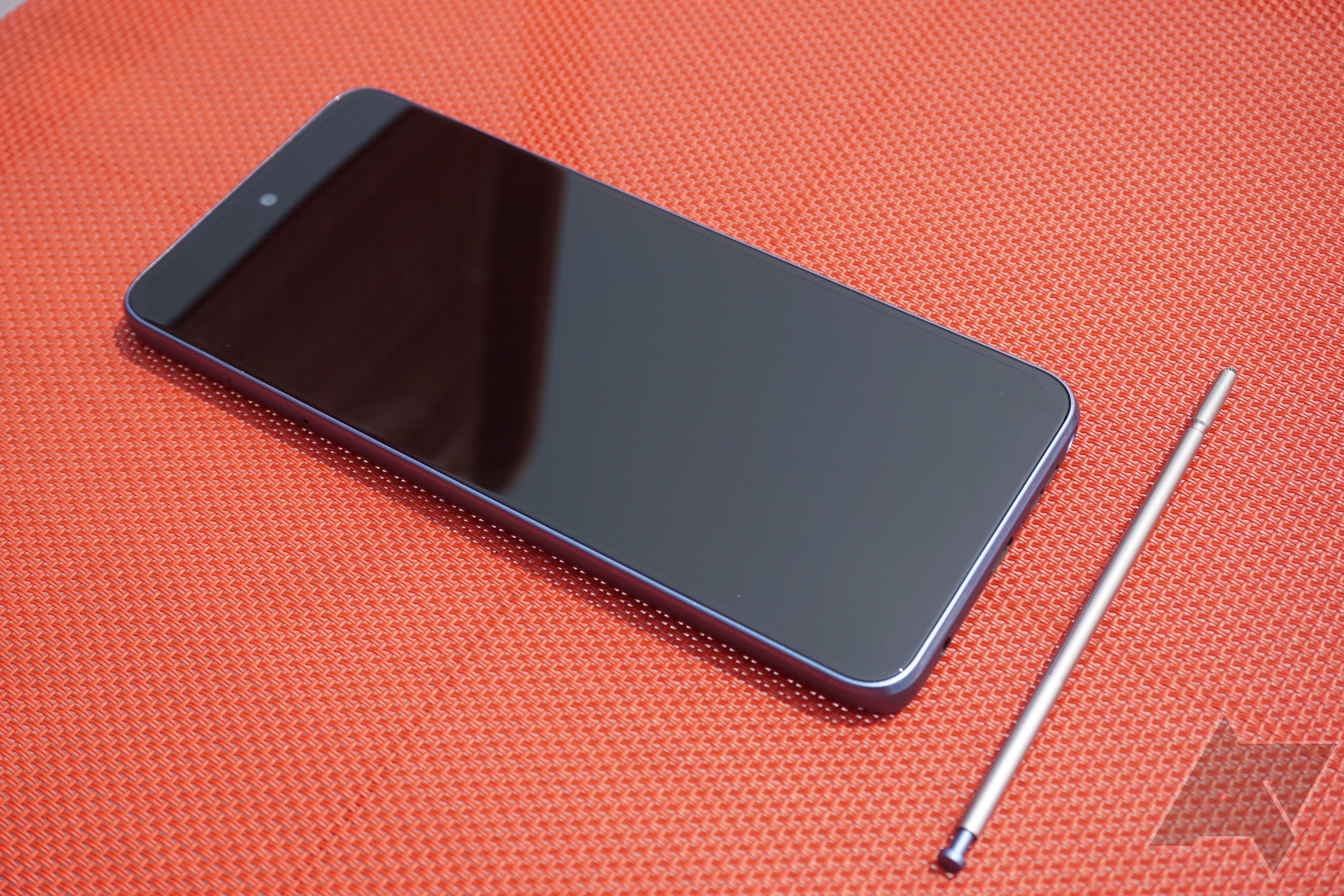 The front of the Moto G Stylus with the stylus next to it.