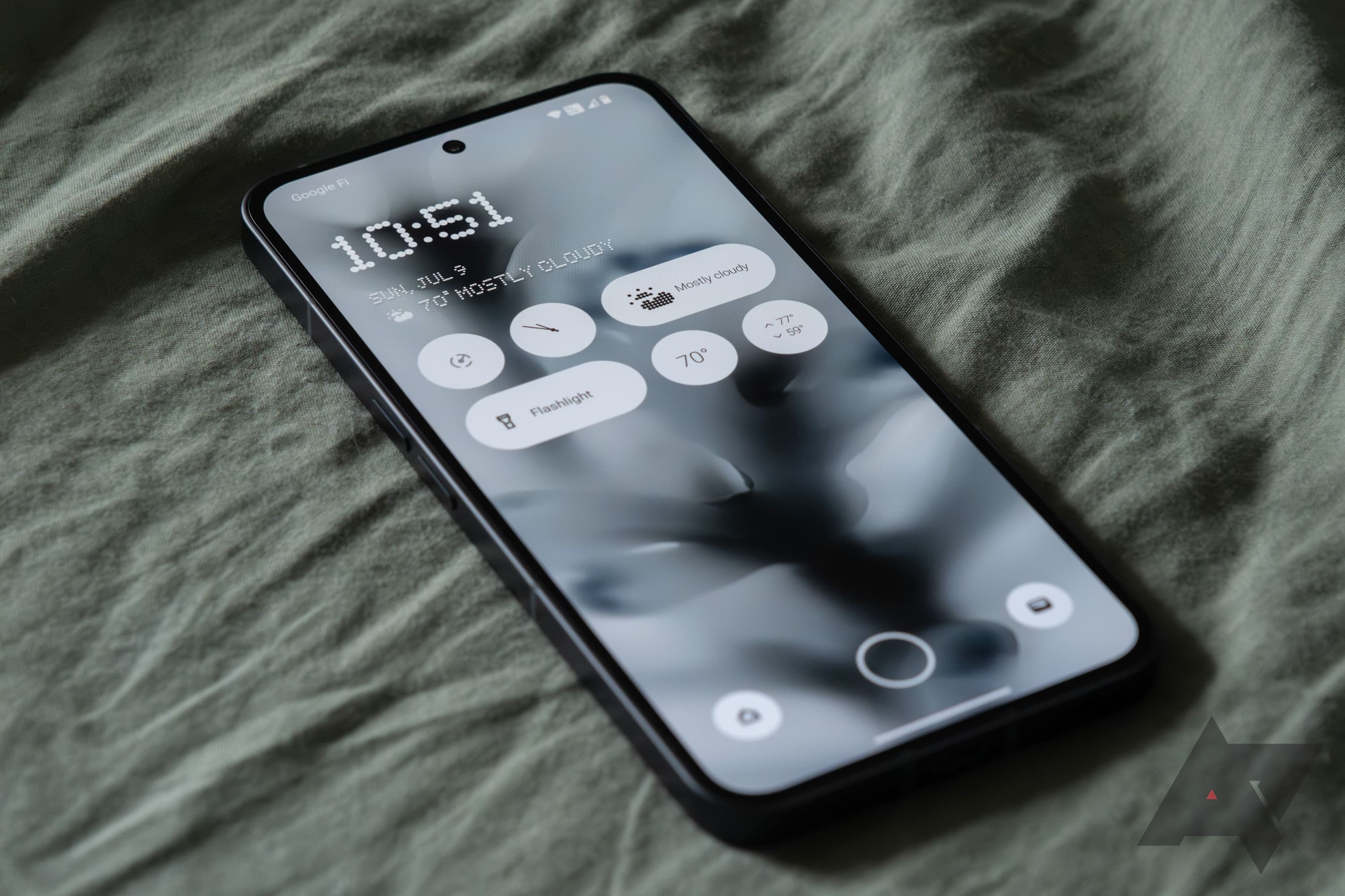 The Nothing Phone 2 showing the lock screen widgets