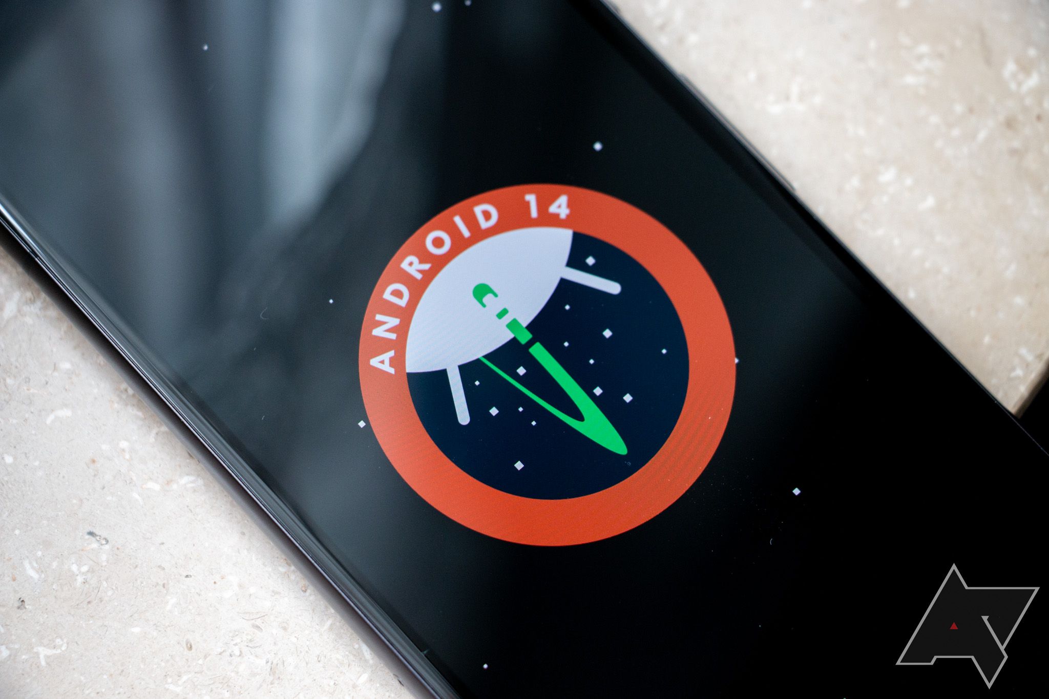 The Android 14 logo displayed on a phone screen