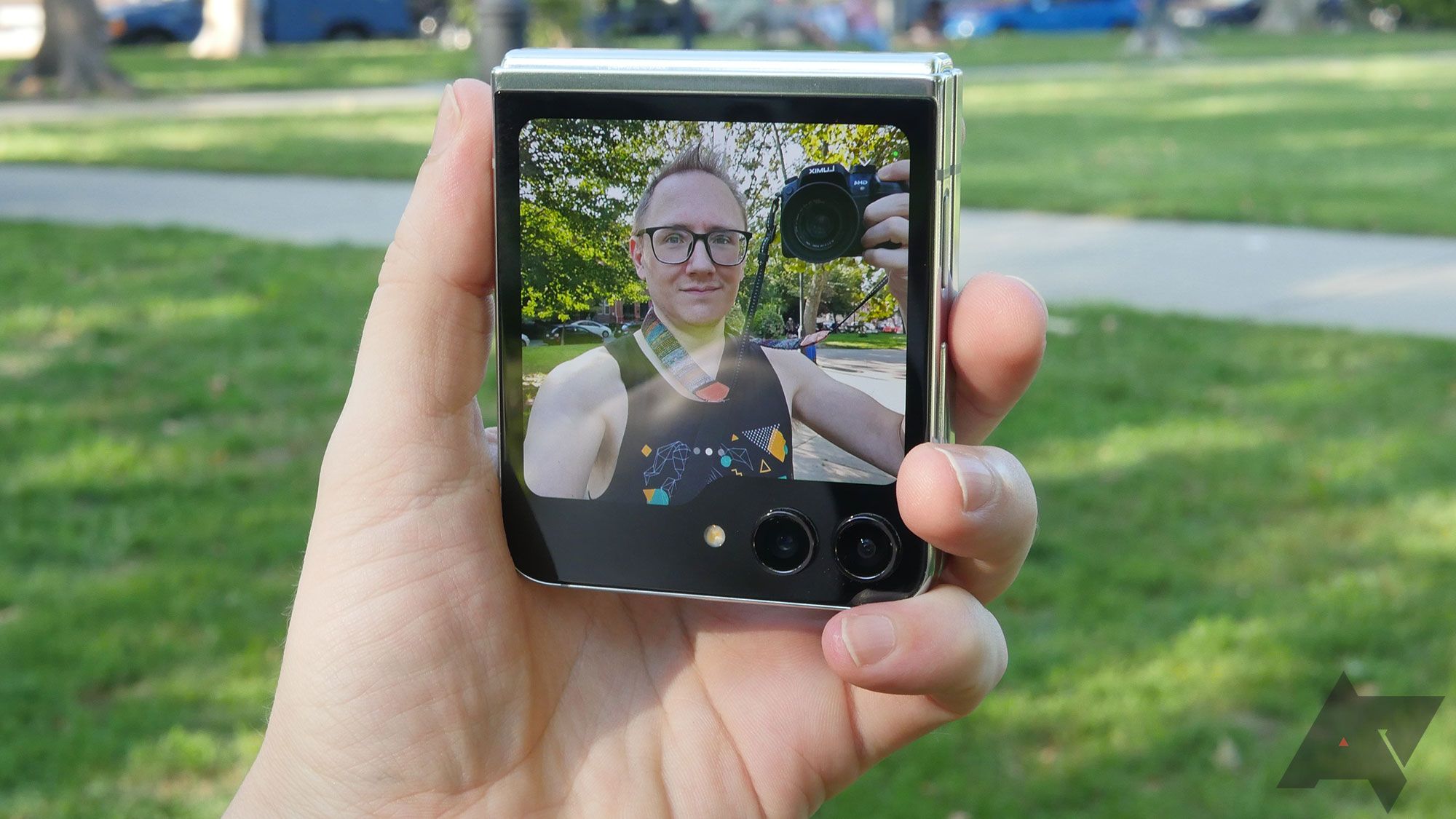 Using the front selfie camera on a Samsung Galaxy Z Flip 5 in a park