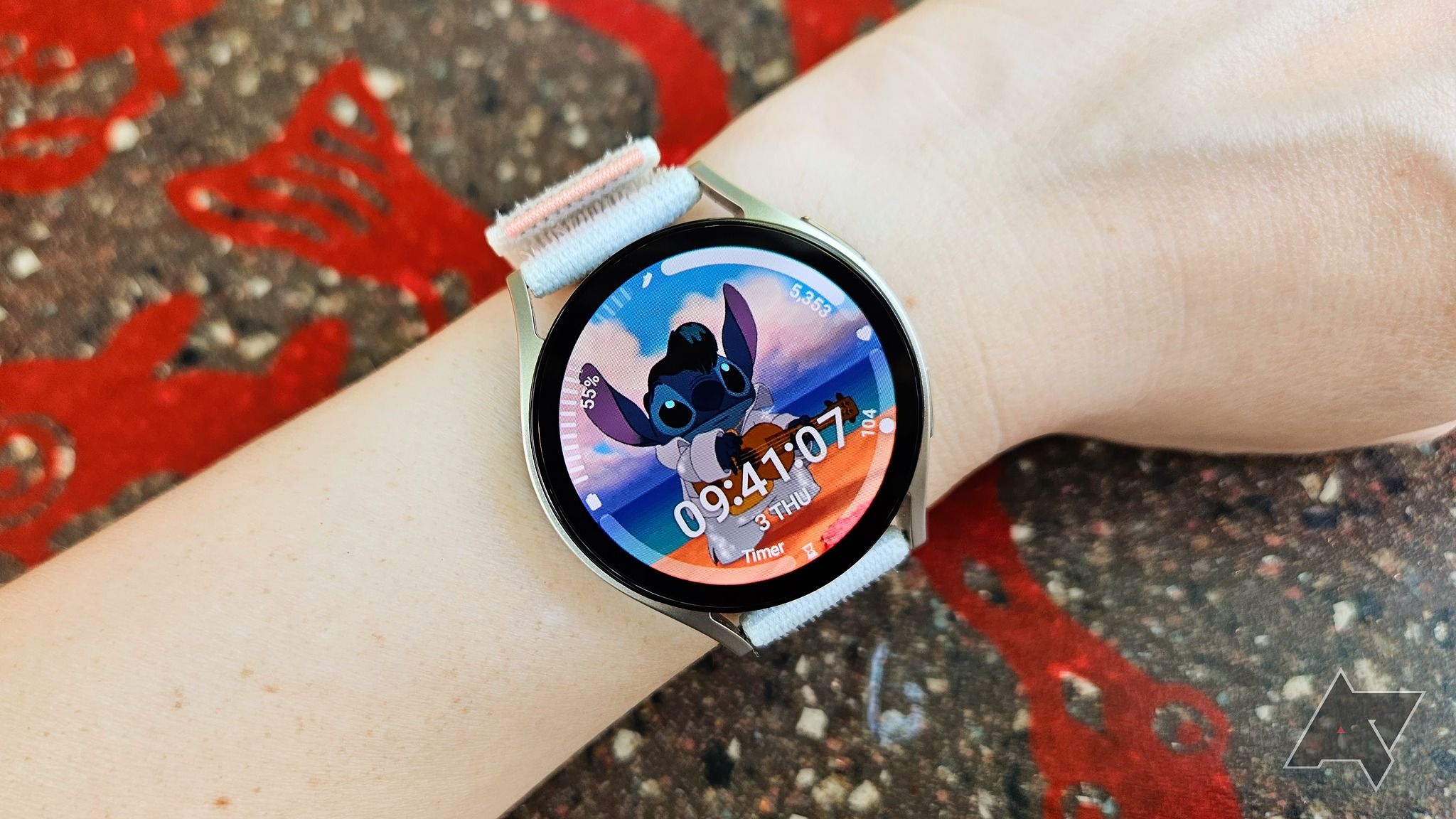 arm wearing galaxy watch 6 with screen turned on