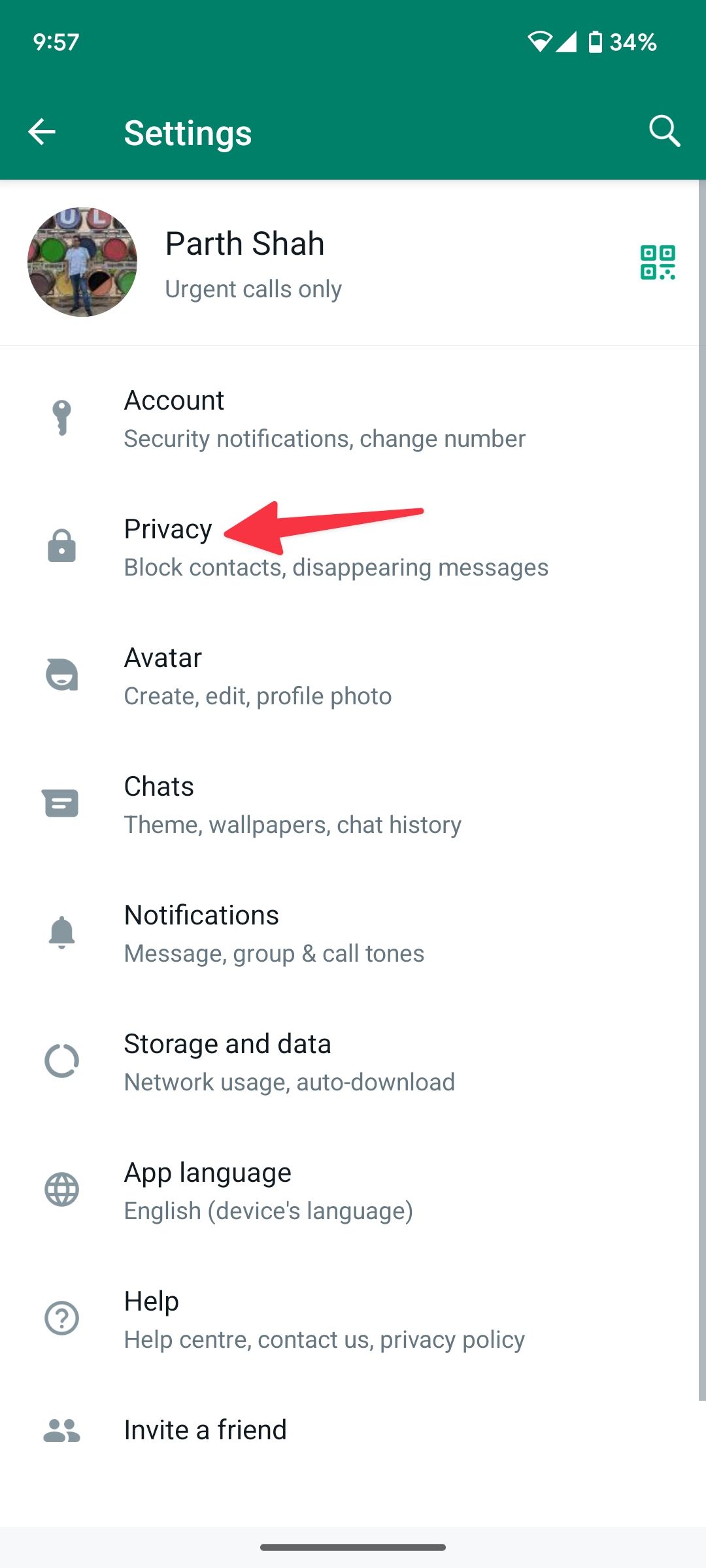 red solid arrow pointing to privacy menu in WhatsApp