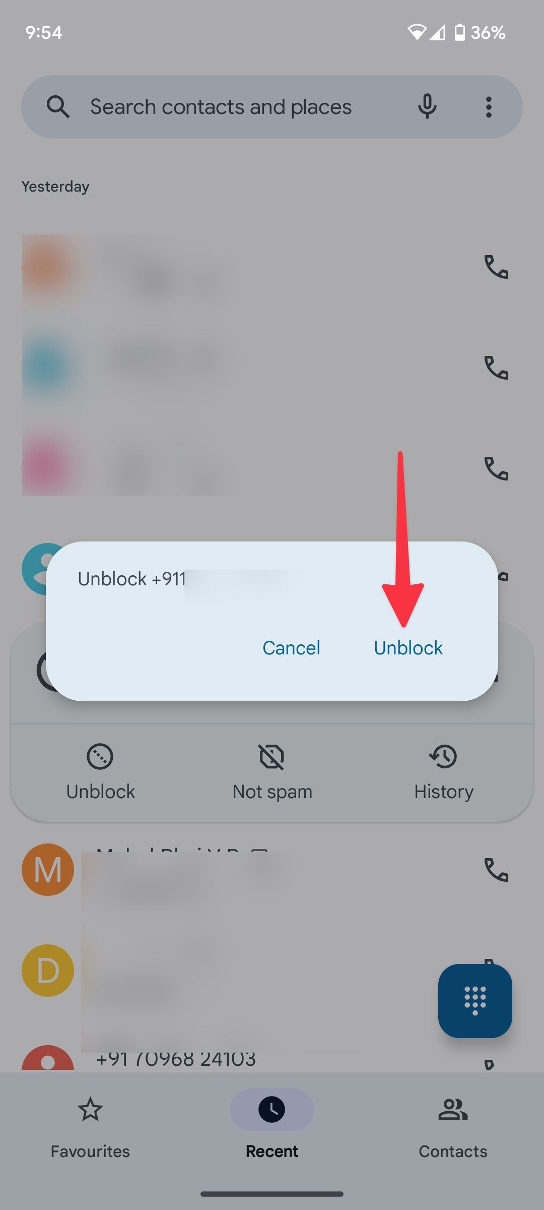 red solid arrow pointing to unblock option on a number on Phone app