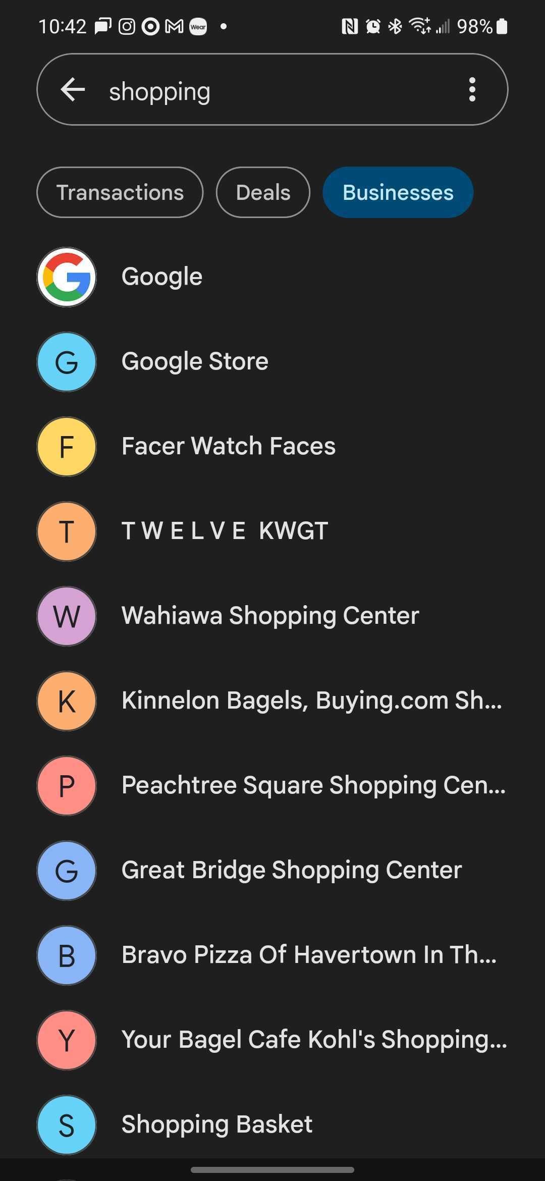 Google Pay in dark mode with an alphabetical list of businesses beginning with Google.