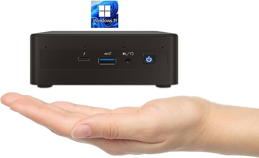 Intel Nuc phtoshopped above hand