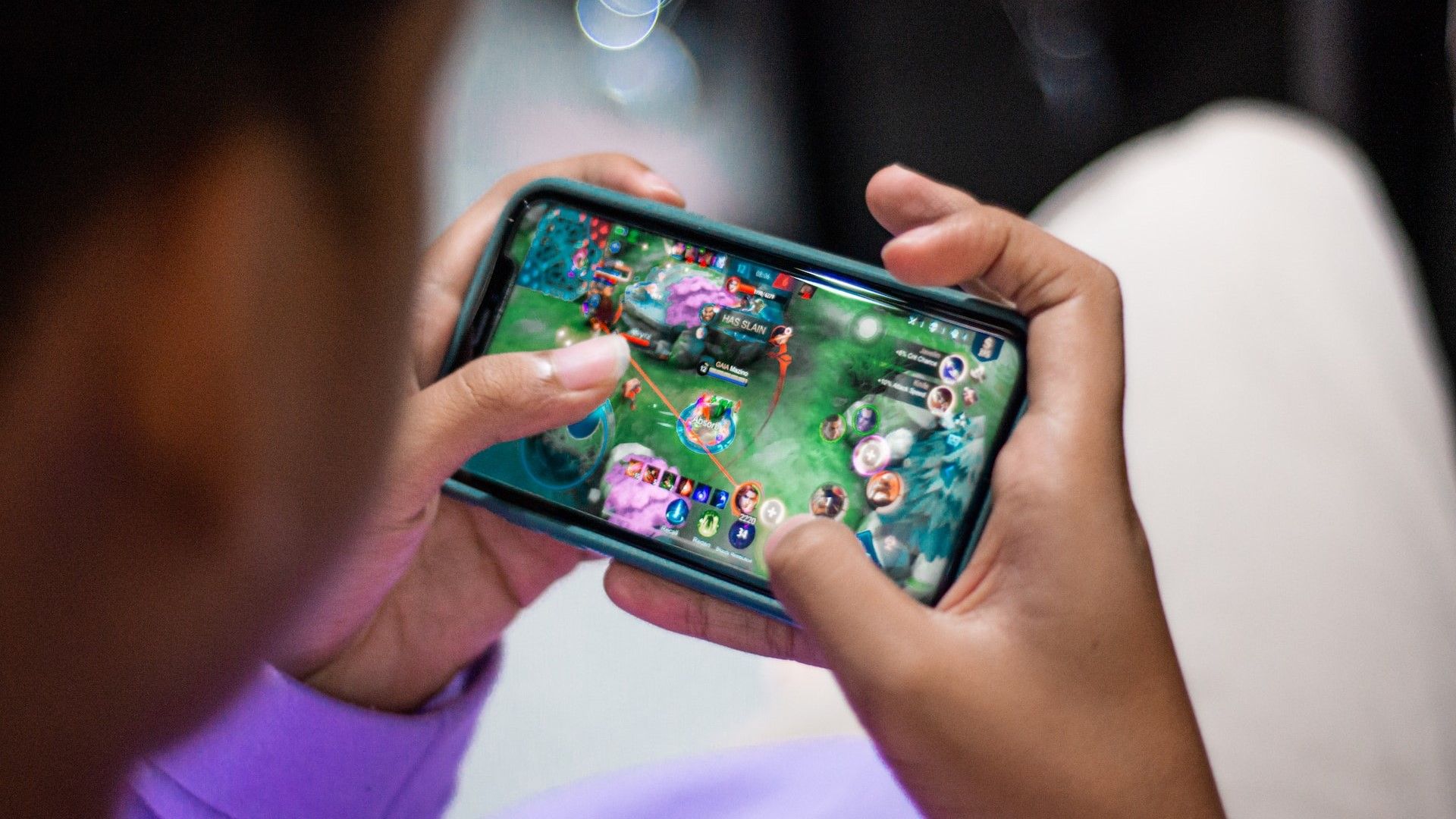 A person using their phone for gaming.