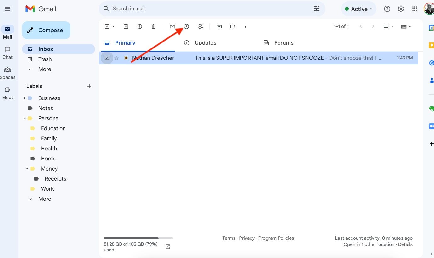 The Gmail web inbox with a red arrow pointing to the clock icon on the ribbon above the message listing.