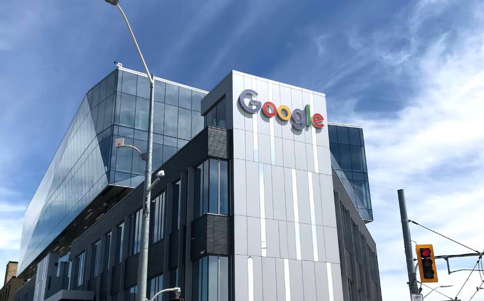 A Google office building with the Google logo on the side of the building