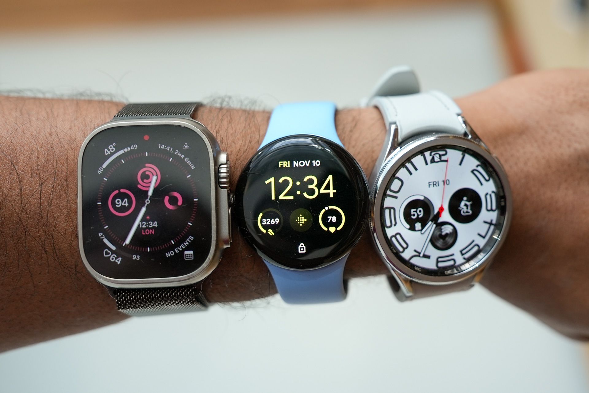 Apple Watch Ultra next to the Pixel Watch 2 and Galaxy Watch 6 Classic