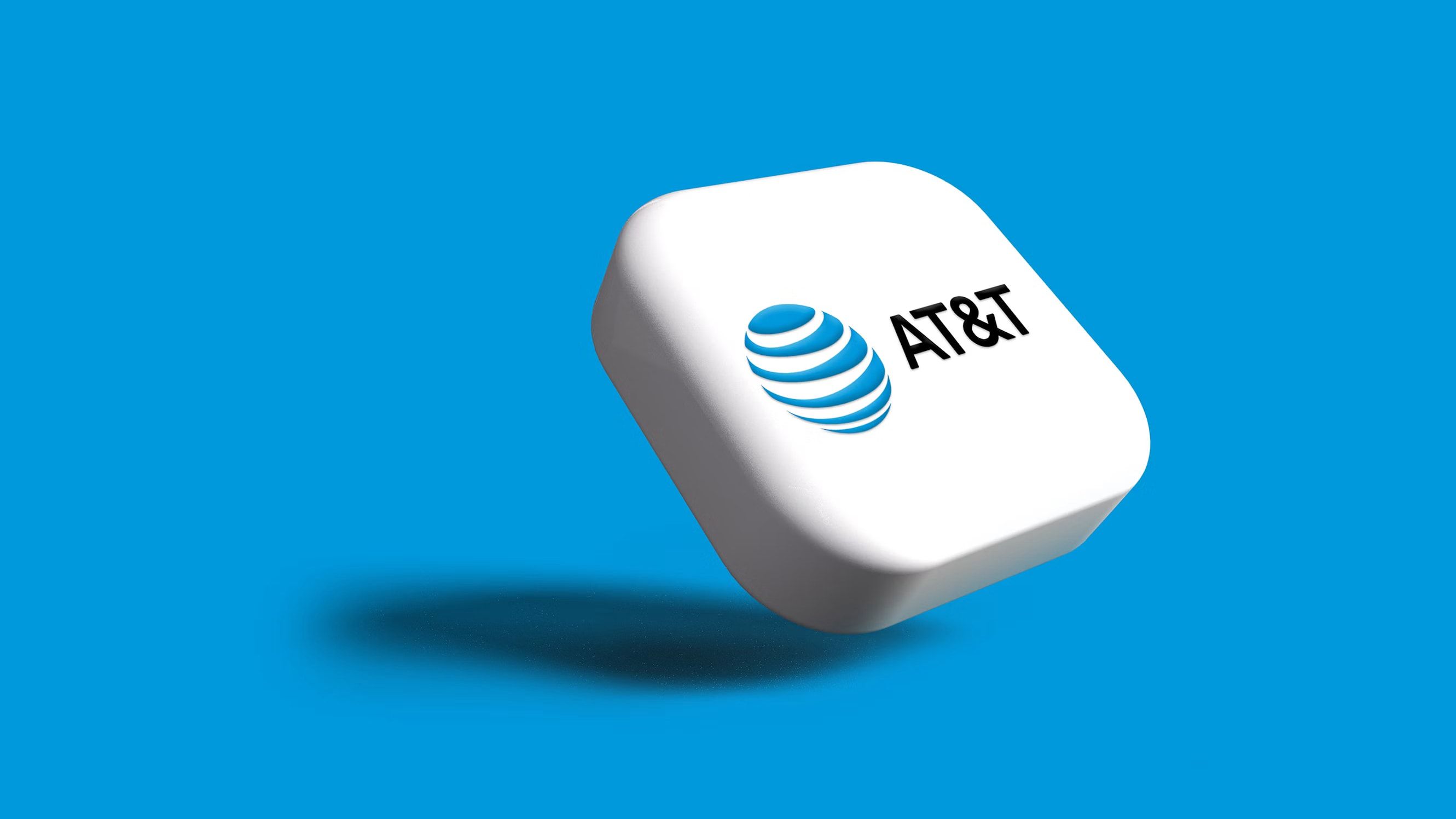 O logotipo da AT&T em um botão branco contra um fundo azul.