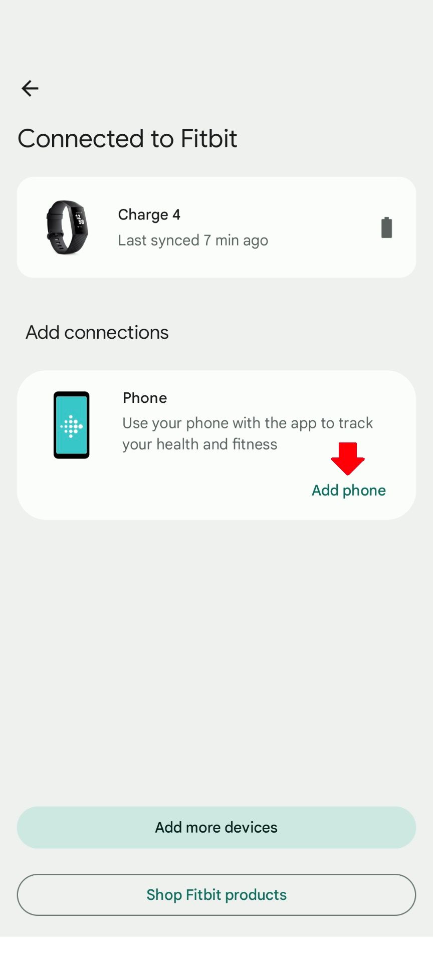 The Devices screen in the Fitbit app with a red arrow pointing to the Add Phone button