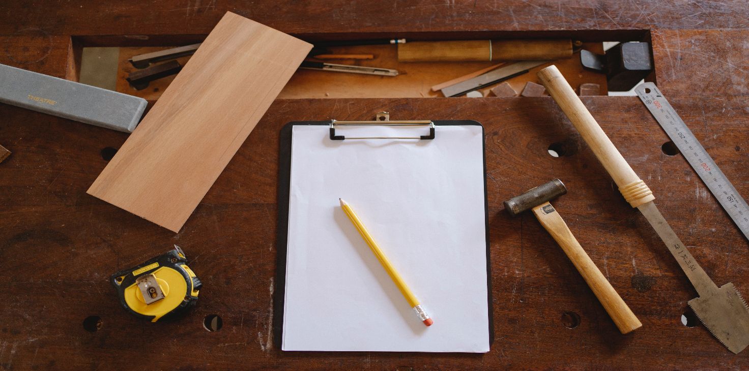 Image of a clipboard resting on a work bench