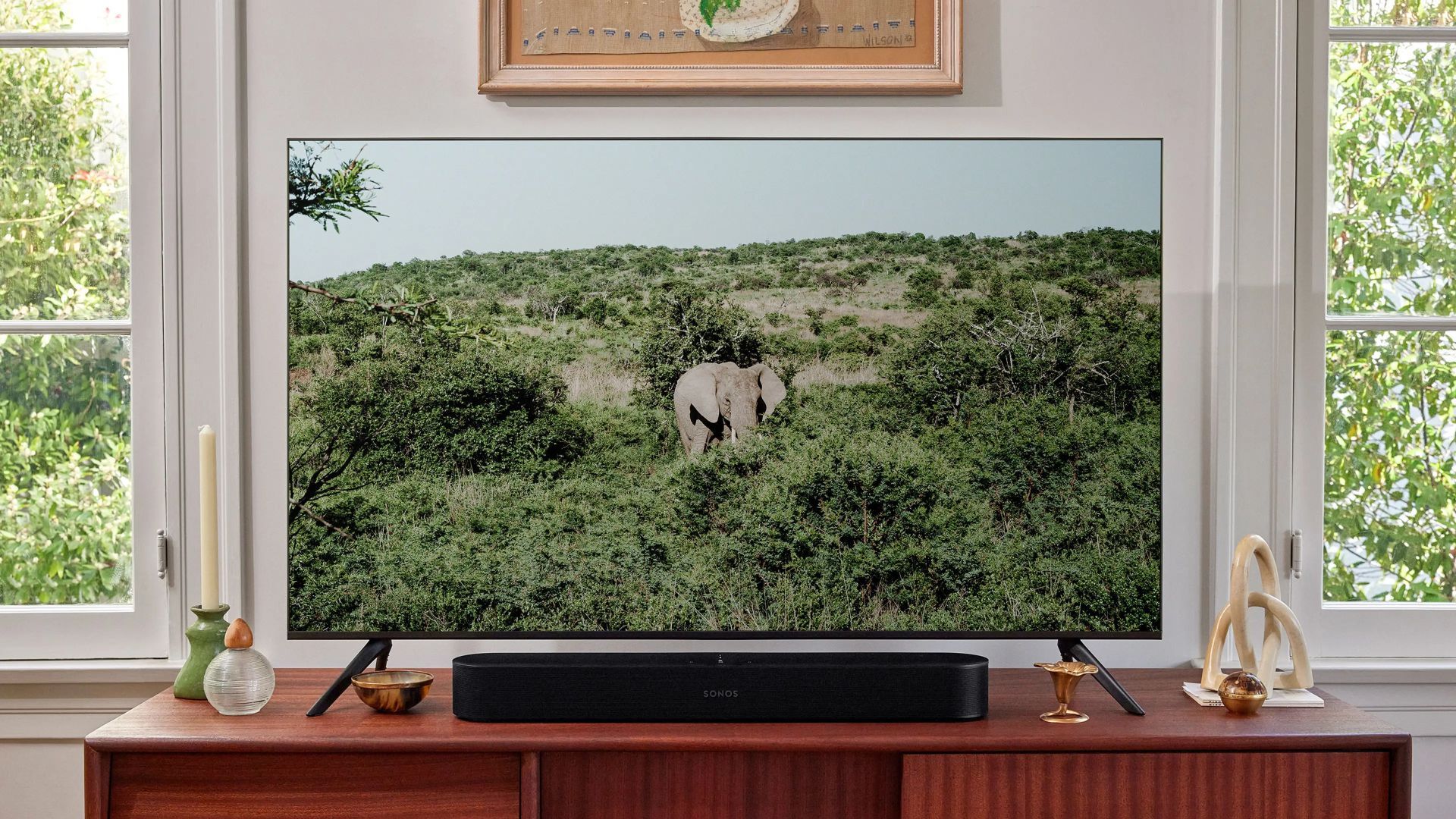 The Sonos Beam soundbar on a TV stand