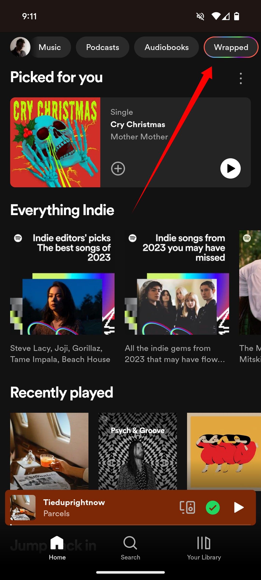 An arrow pointing to the specific location of the Wrapped option in the Spotify app