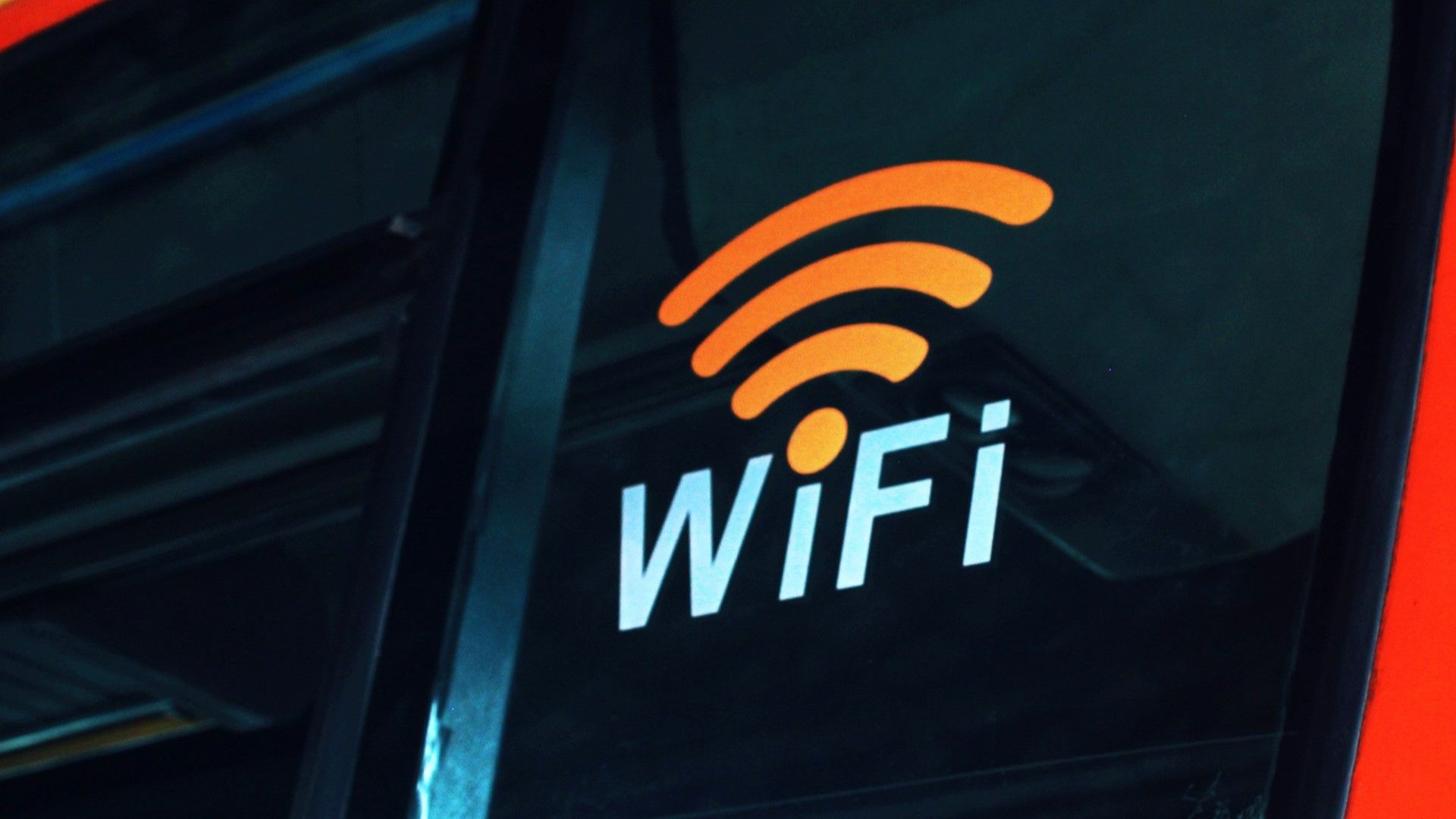 A colorful Wi-Fi sign on a dark background