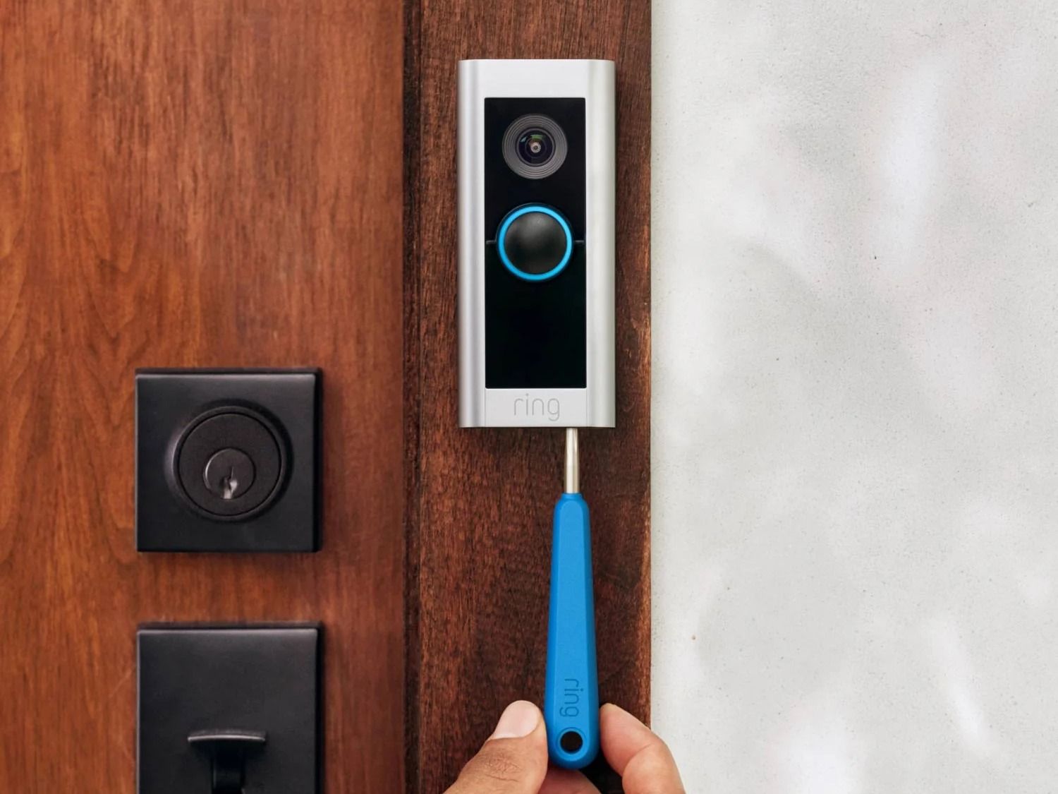 Installing the Ring Video Doorbell Pro 2 on brown door 