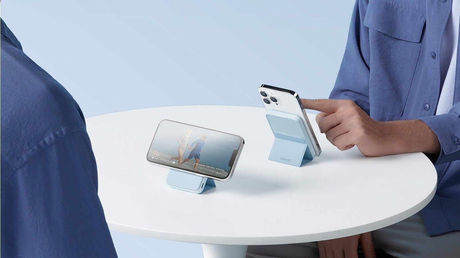 Image showing two iPhones using Anker 622 power banks on a white table