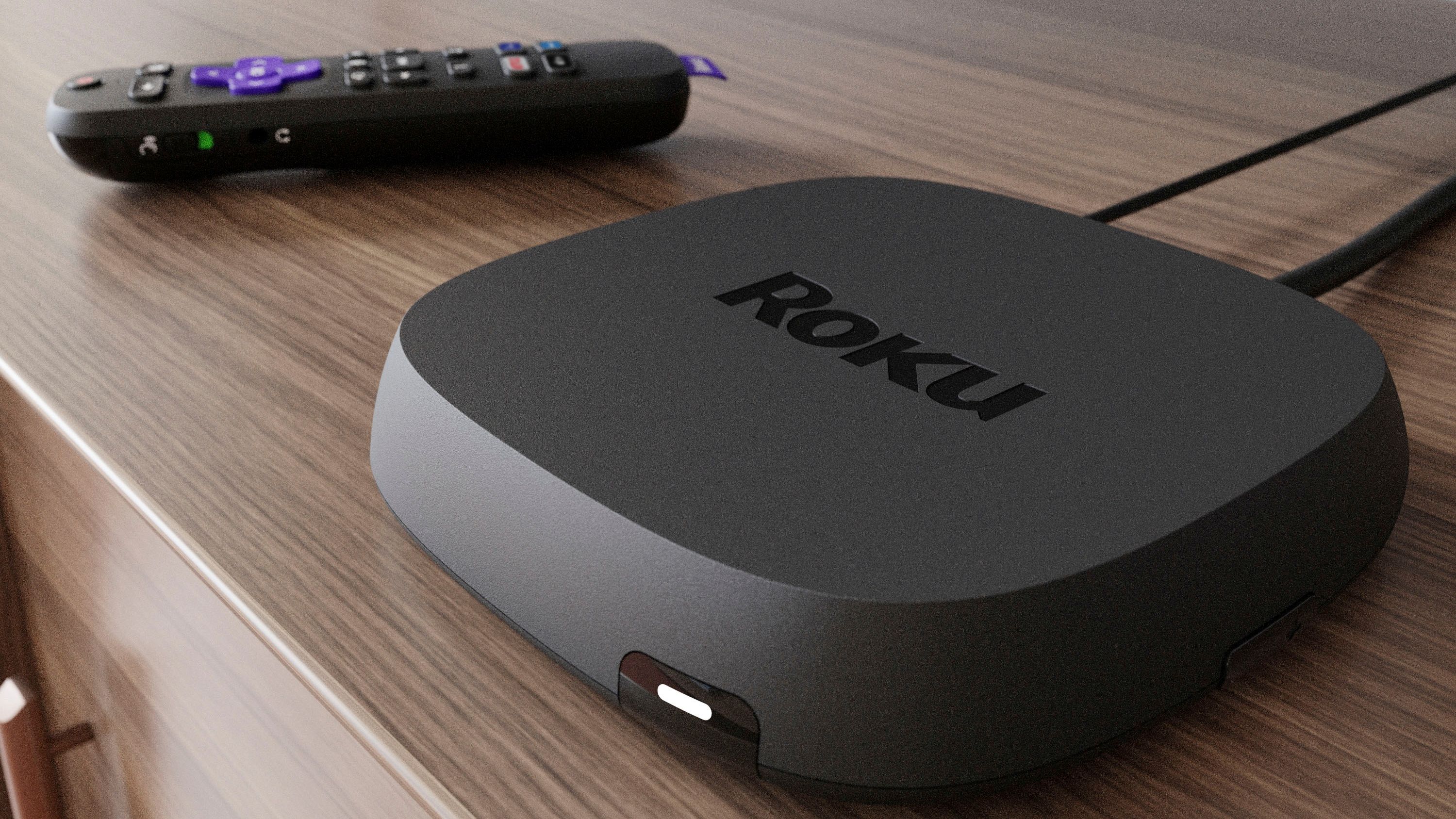 roku ultra with remote on a cabinet