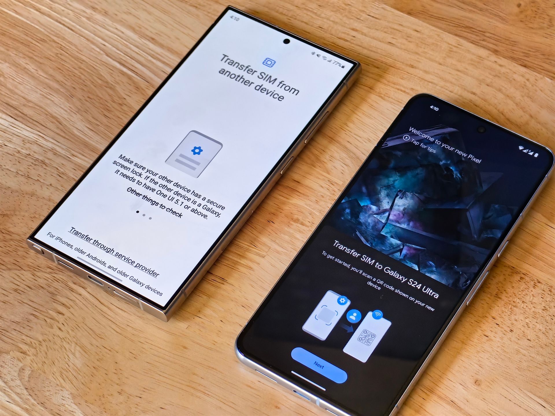 two android phones next to each other with screens on on light wood desk
