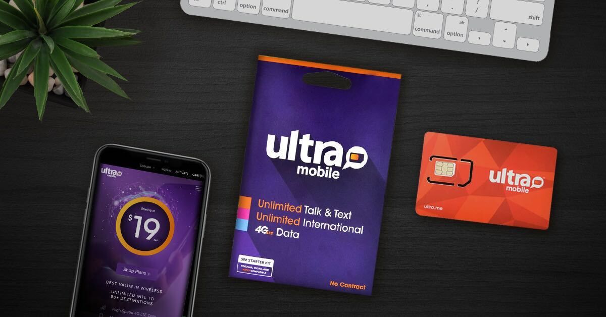 Image of Ultra Mobile SIM card and materials, and Ultra Mobile phone on a desk