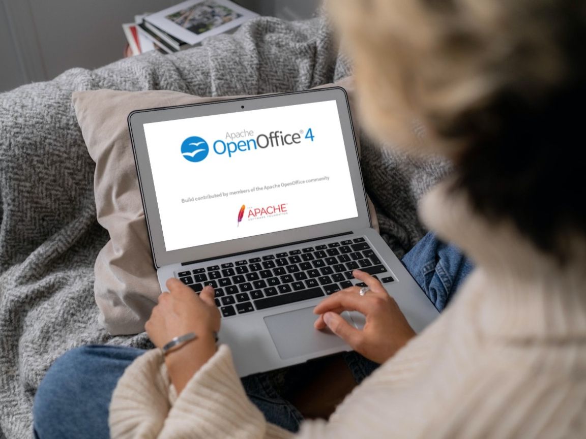 A woman uses OpenOffice on her laptop