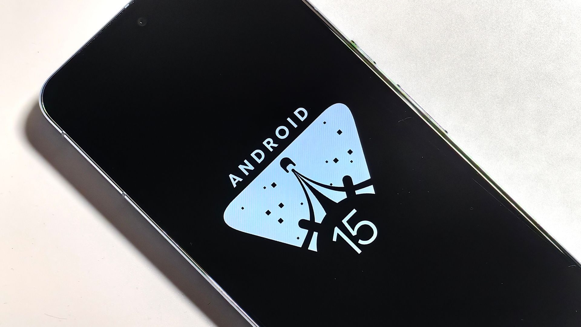 The Android 15 logo on a phone screen
