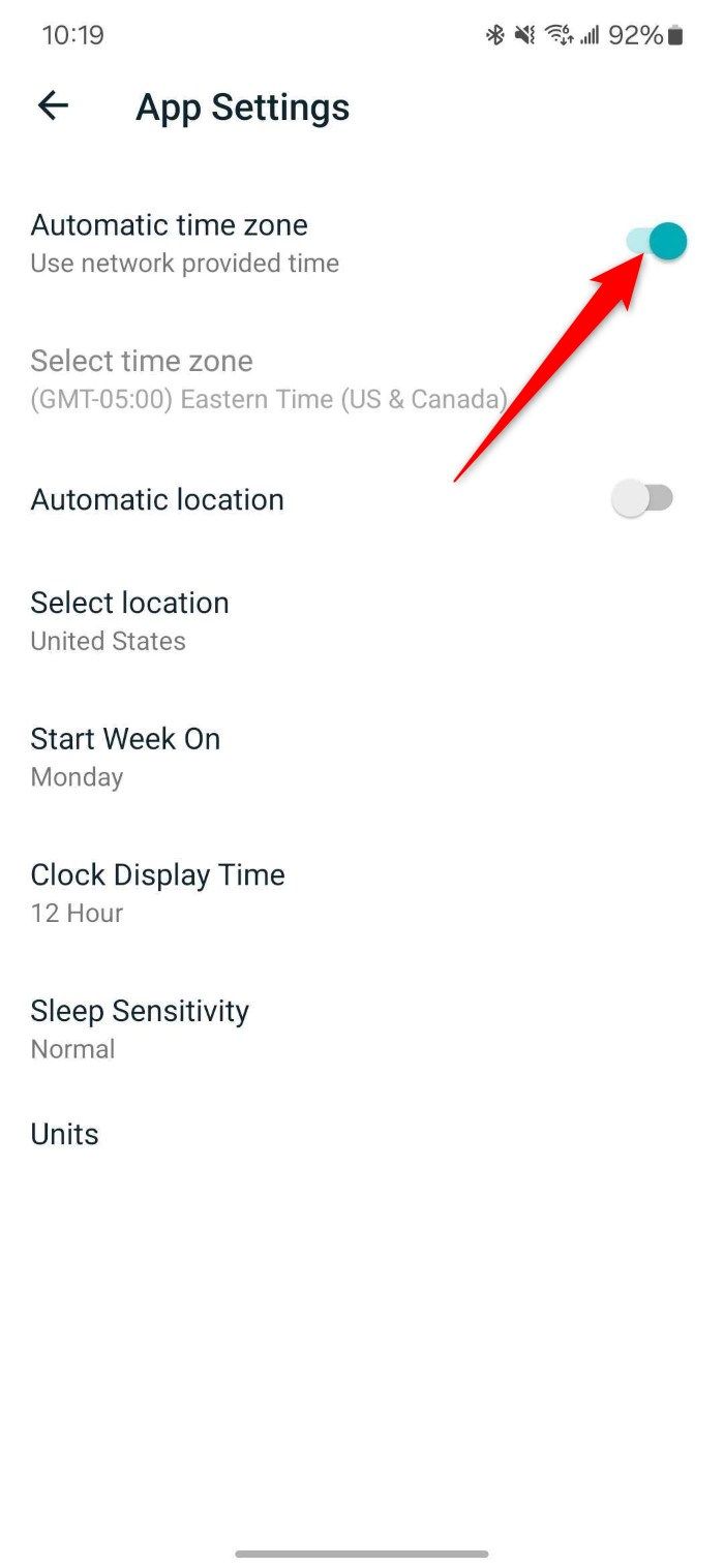 Screenshot showing Automatic time zone toggle in the Fitbit Android app