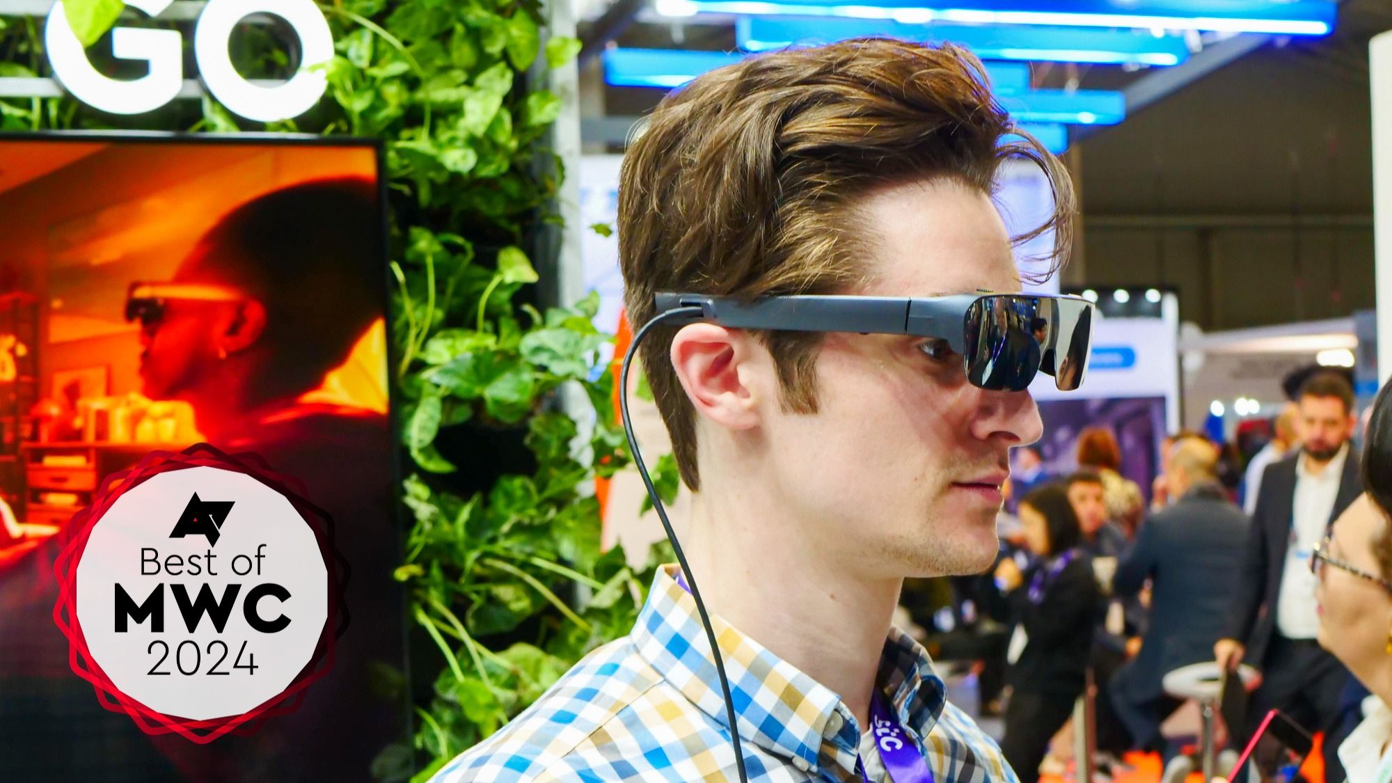 The Tecno Pocket Go and AR Pocket vision on a man's head at MWC 2024