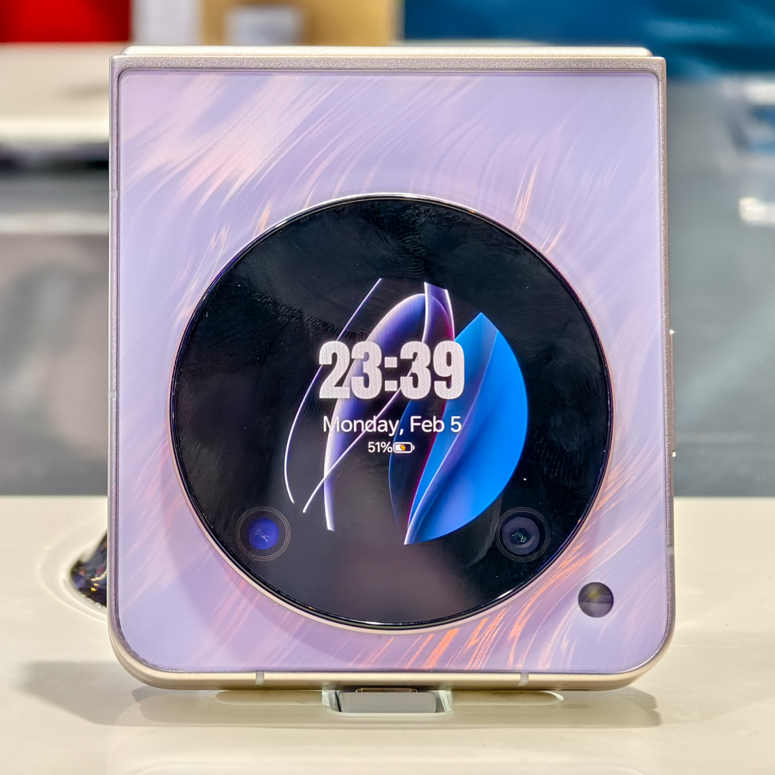 Nubia Flip 5G in a purple finish, shown front on while closed with the time on the external display, at MWC 2024