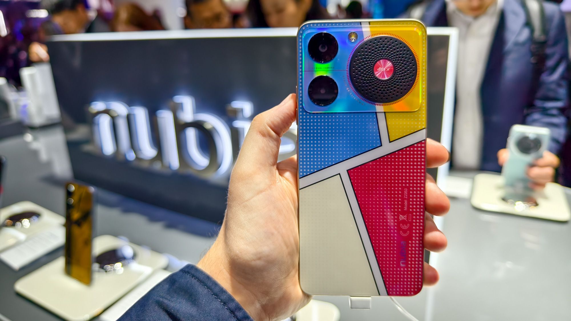 Nubia Music phone at MWC 2024, shown photographed in someone's hand with a Nubia logo sign behind