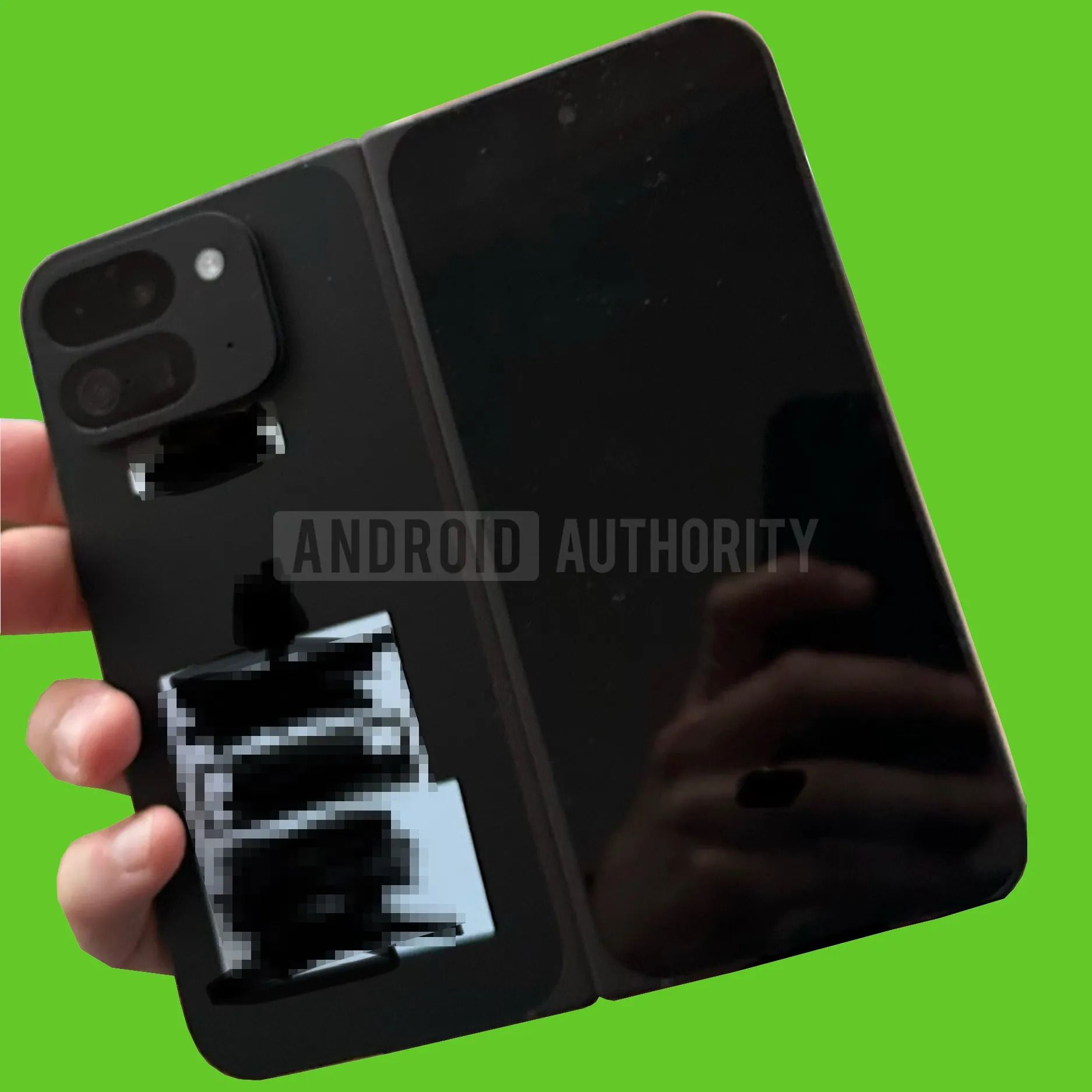 A ⁣potential Pixel Fold 2 model being held by a hand and heavily censored.