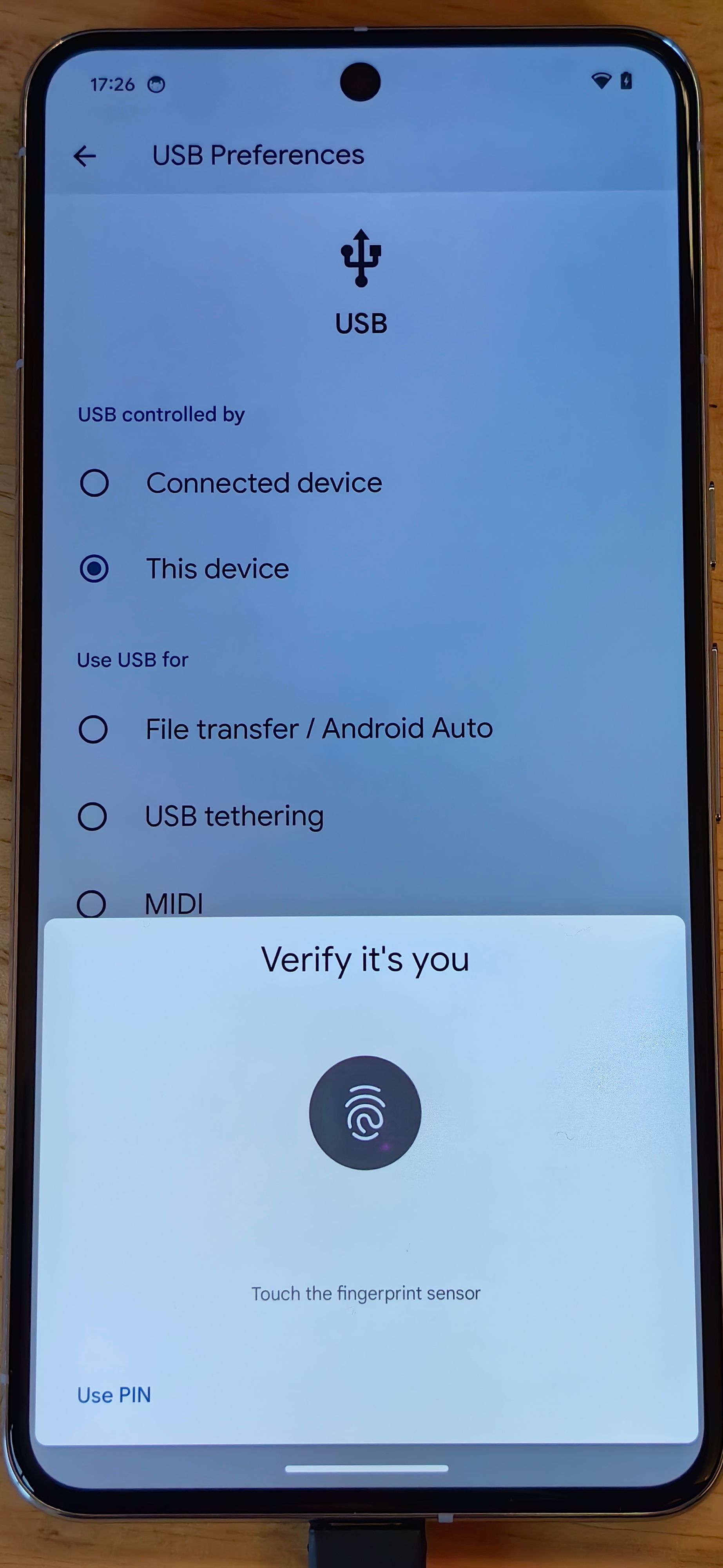 Photo of a phone showing Android 15's authentication screen for changing USB modes