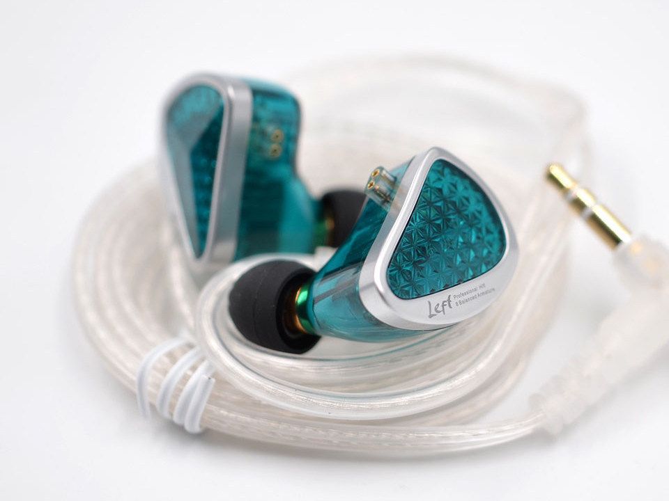 A lifestyle image of green KZ AZ 16 Pro IEMs against a white background