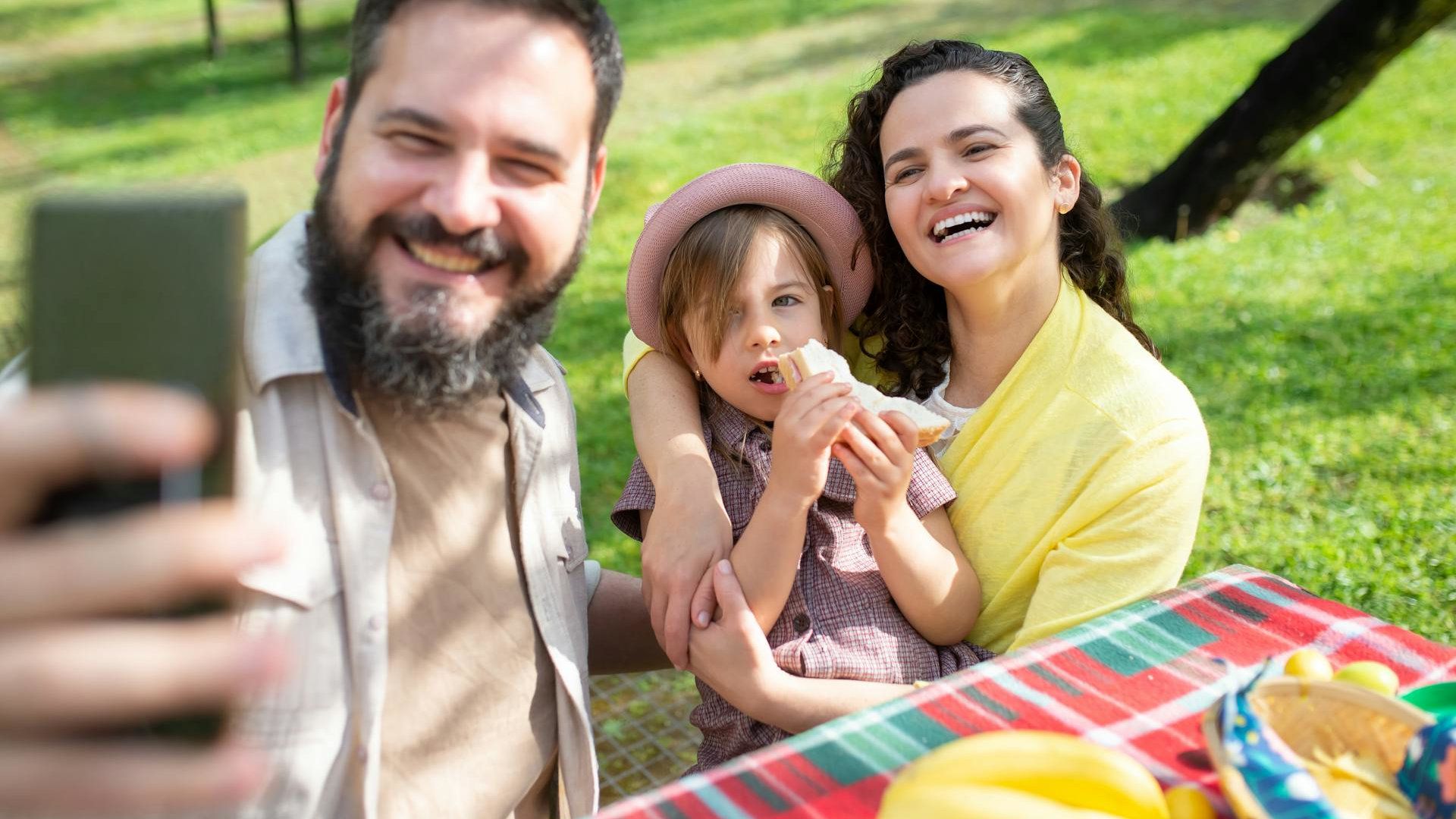 A person taking selfie with their family