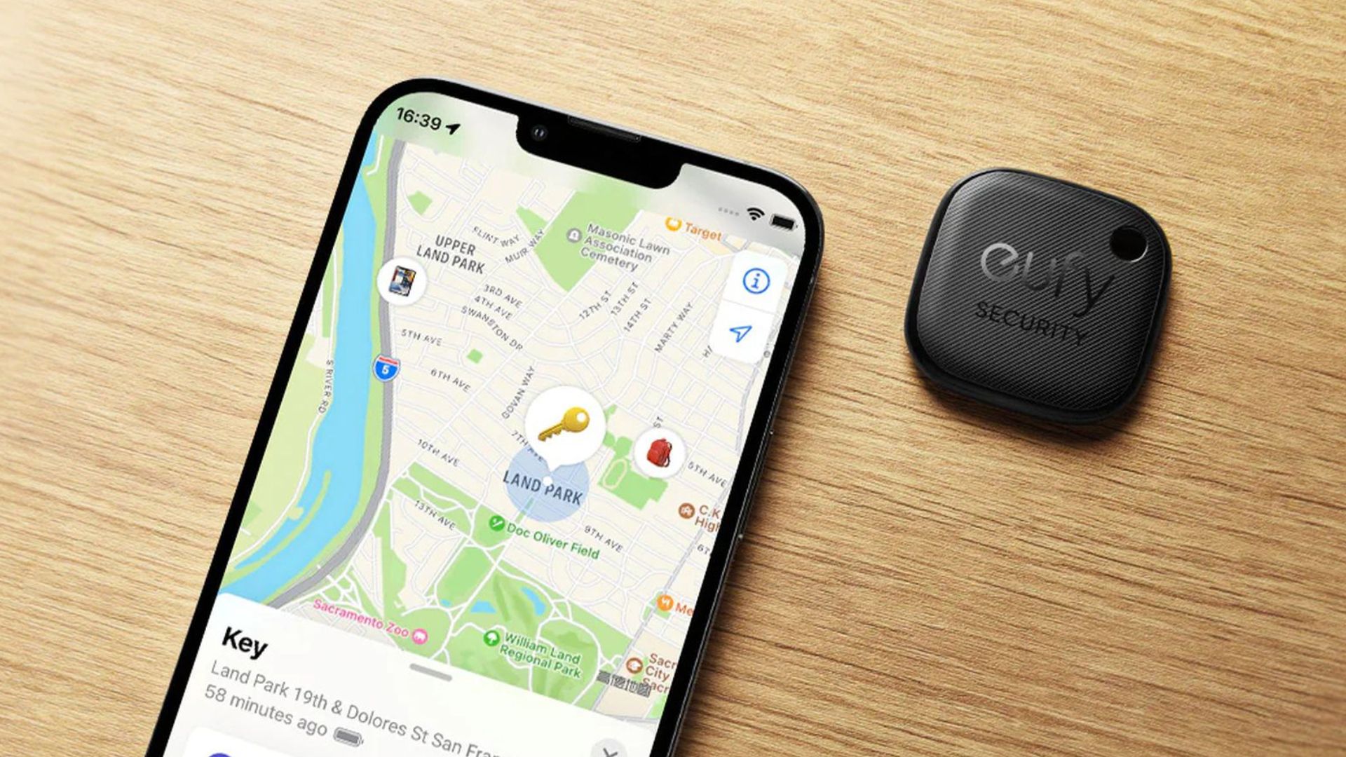 Eufy SmartTrack Link next to an iPhone with maps open