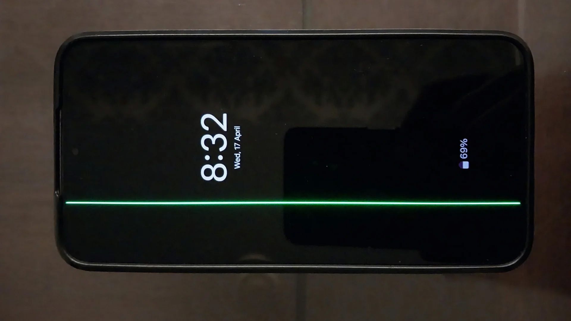 Photo of a Samsung Galaxy S22 Plus with a green line appearing on the display
