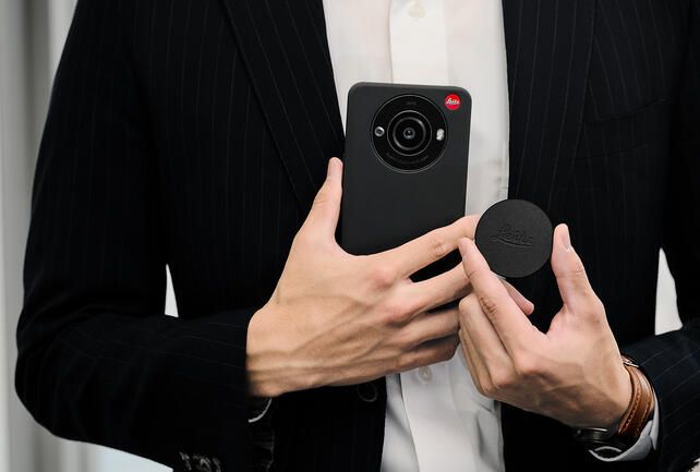 Leica Leitz Phone 3 in black held by a man