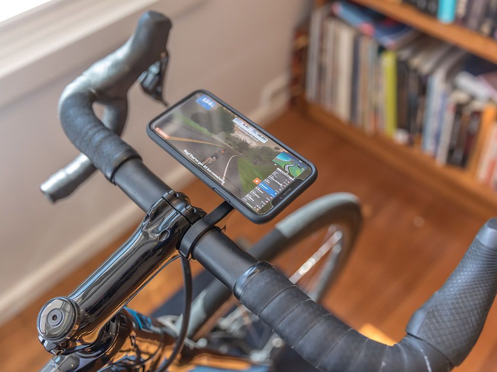 A picture of a phone mounted on the Quad Lock Out Front bike mount
