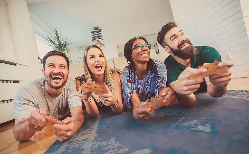 Group of people playing video games with wireless controllers