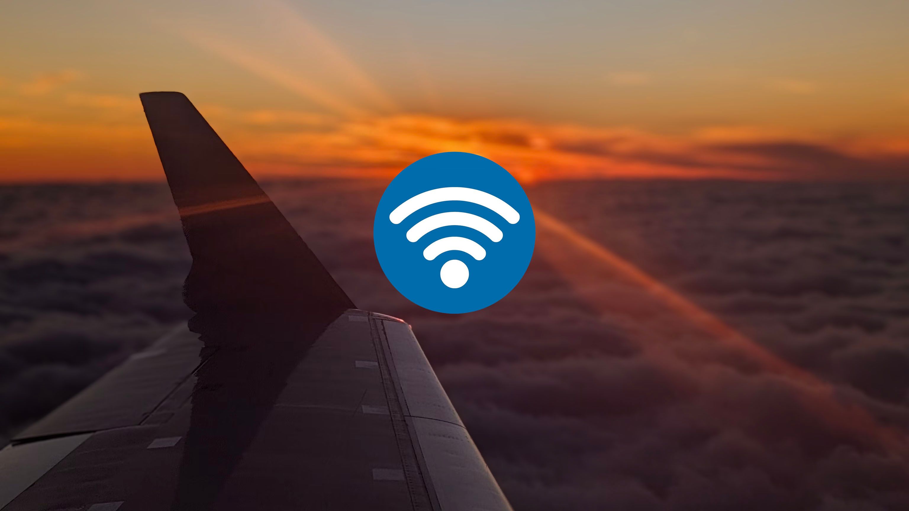Wi-Fi logo and photo of an sunset seen from an airplane