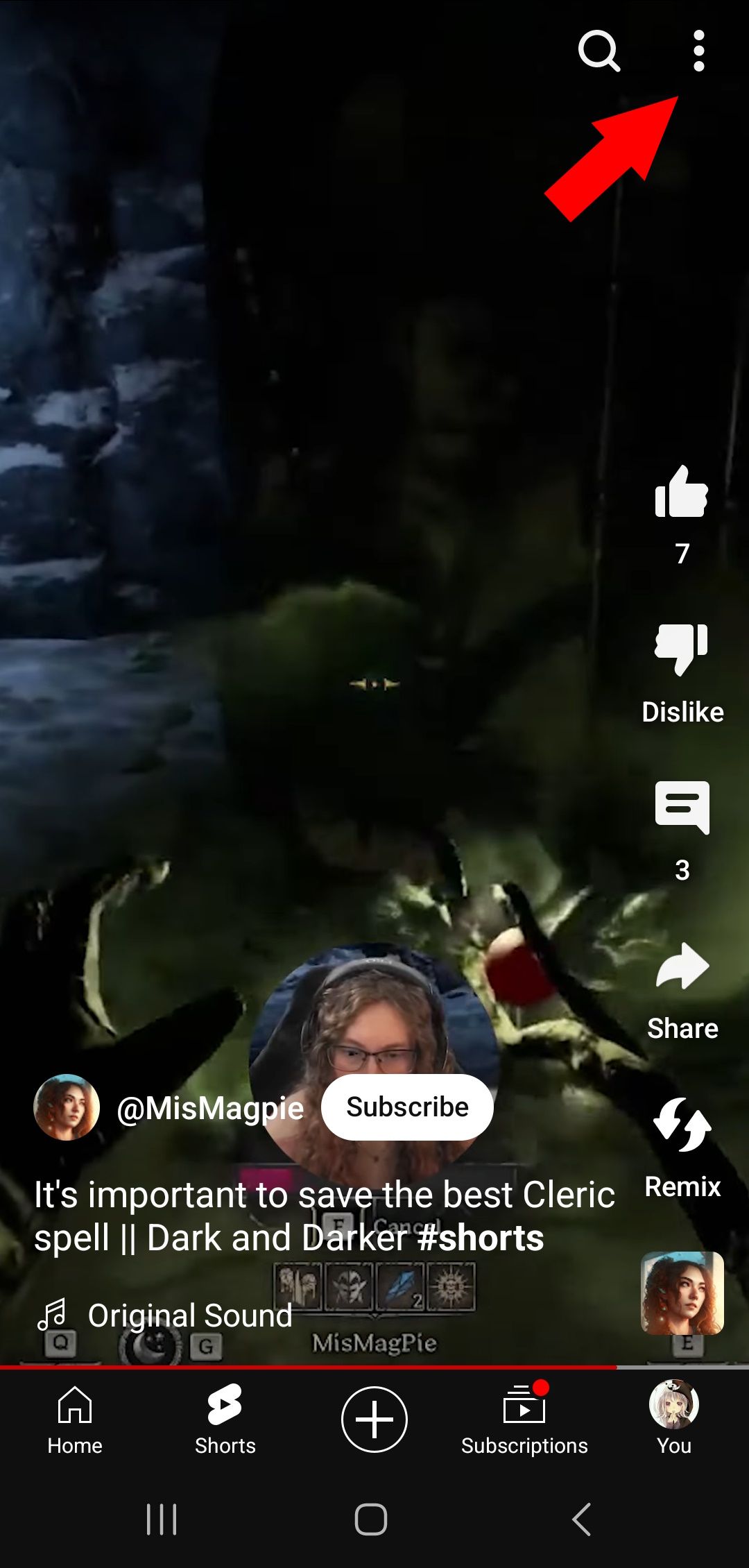 red solid arrow pointing to three dot menu top right on YouTube mobile app