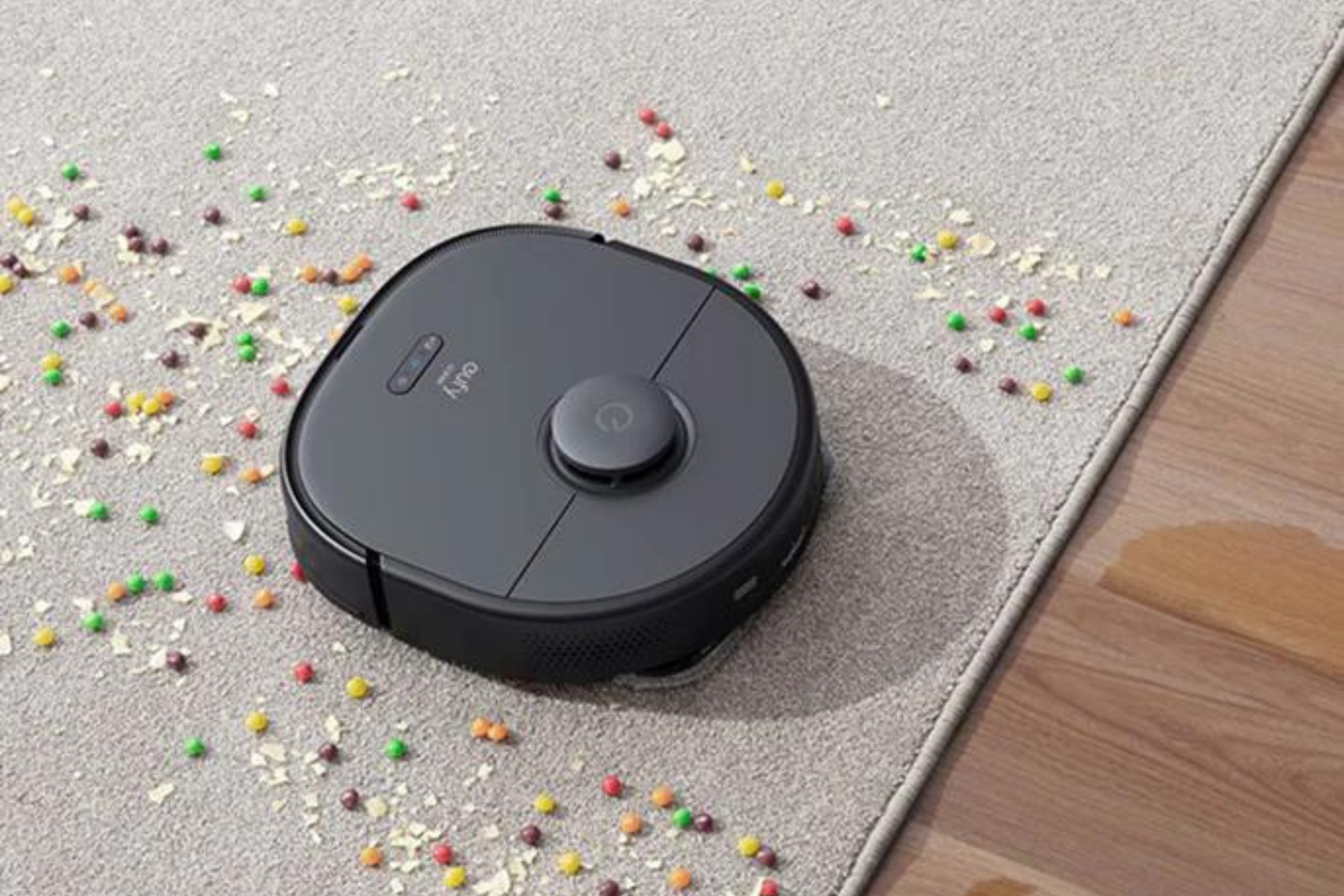 eufy X9 Pro Robot Vacuum and Mop with Auto-Clean Station on carpet eating candy
