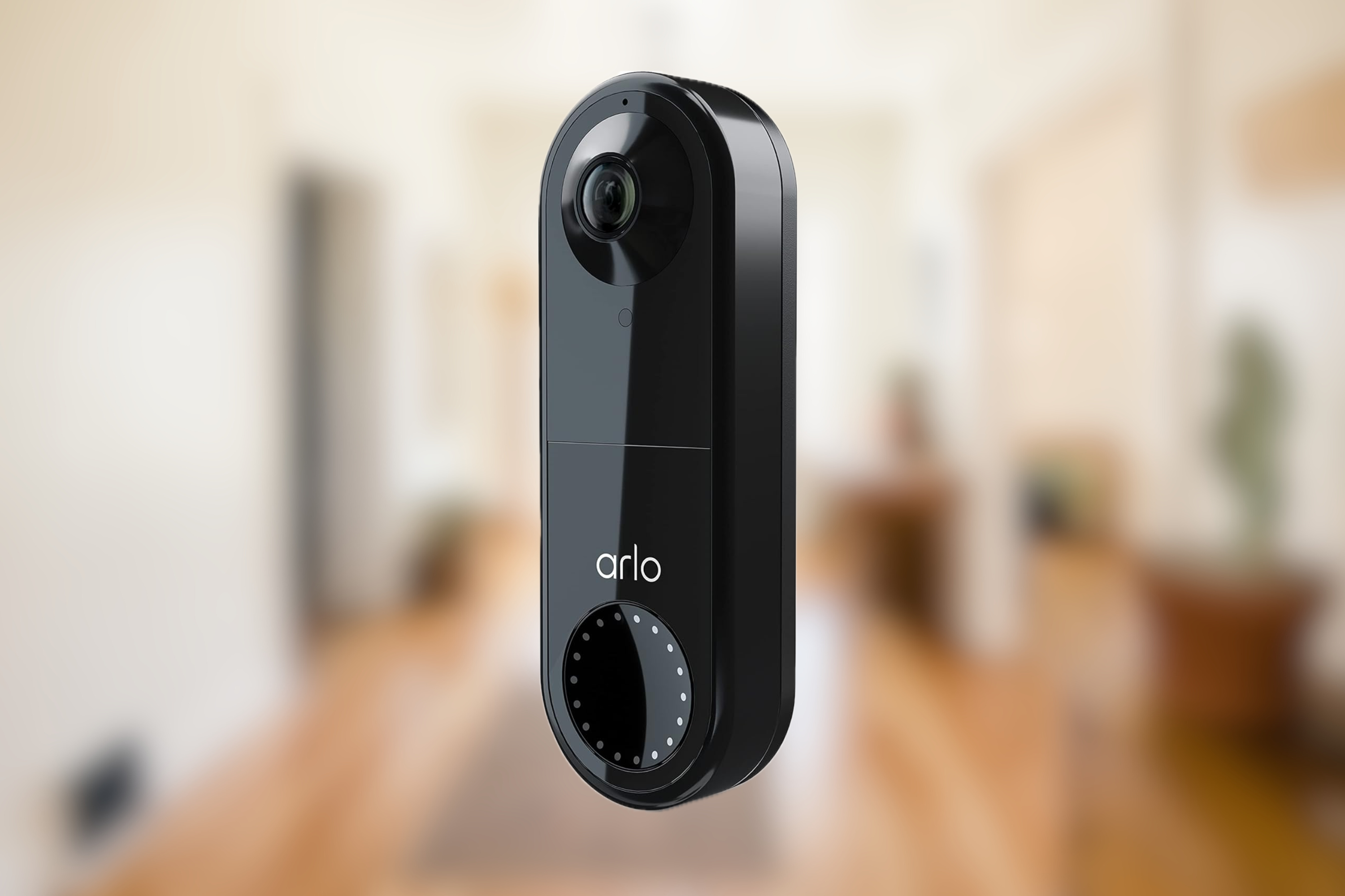 Arlo Essential Wired Video Doorbell in black on blurred background 