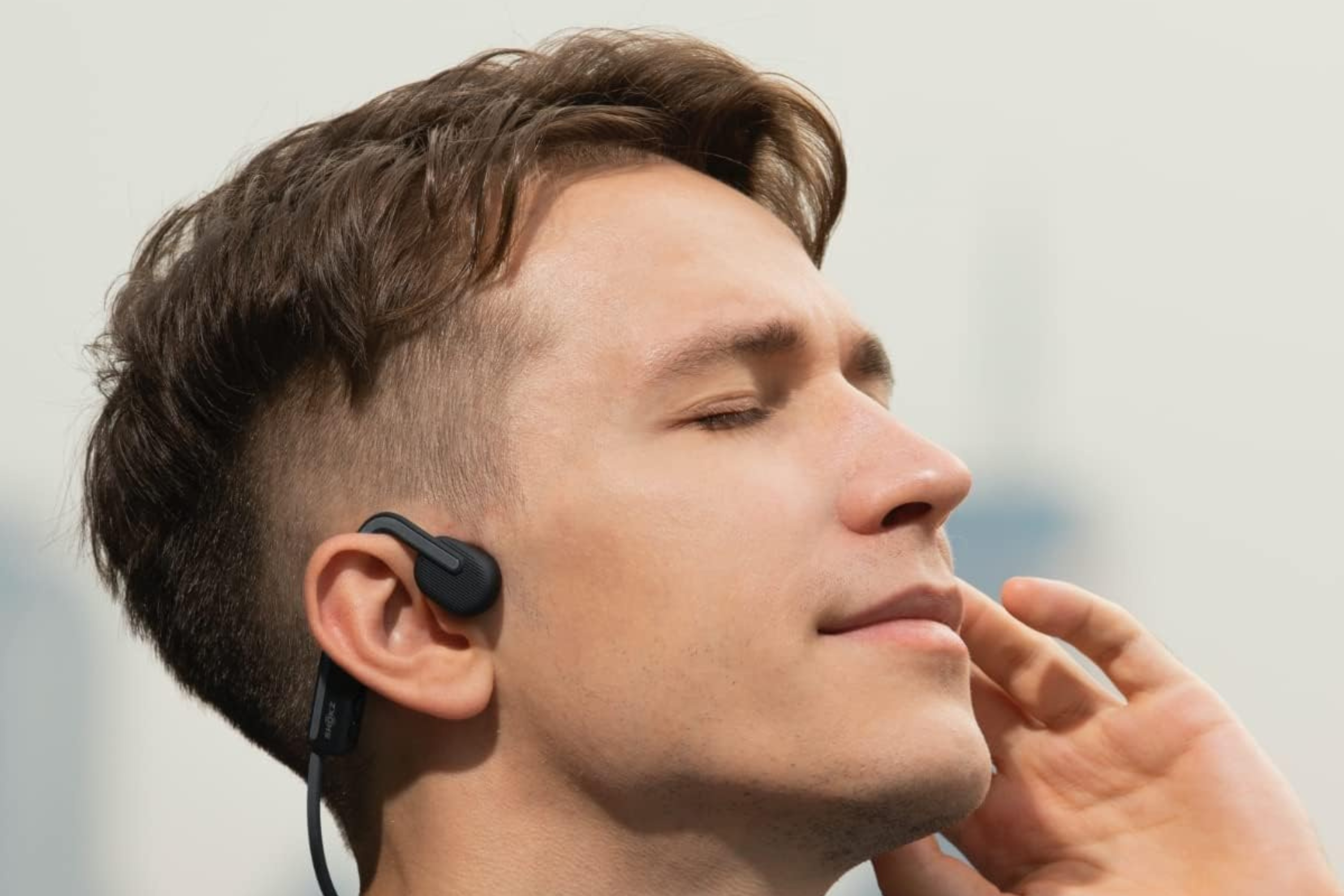 Person wearing SHOKZ OpenMove headphones 