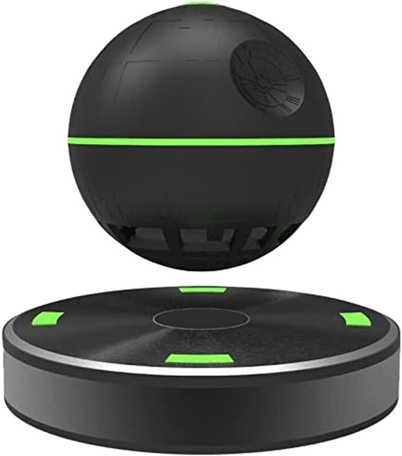 Black sphere-shaped bluetooth speaker hovering above its base against a white background