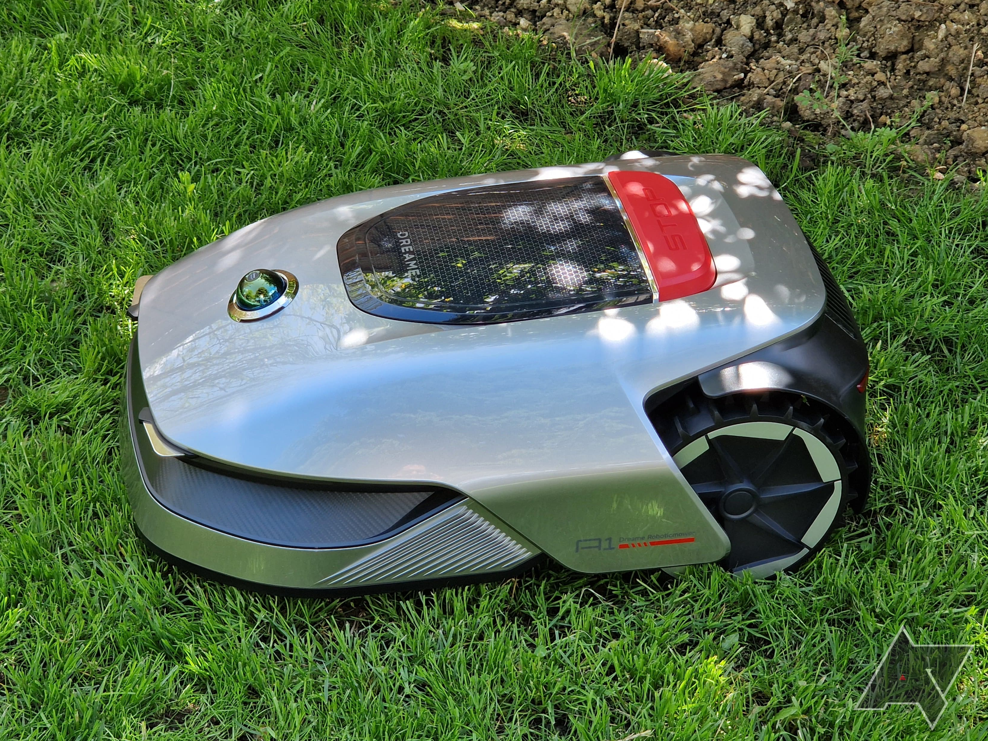 Side view of the Dreametech Robotic Mower A1 on grass