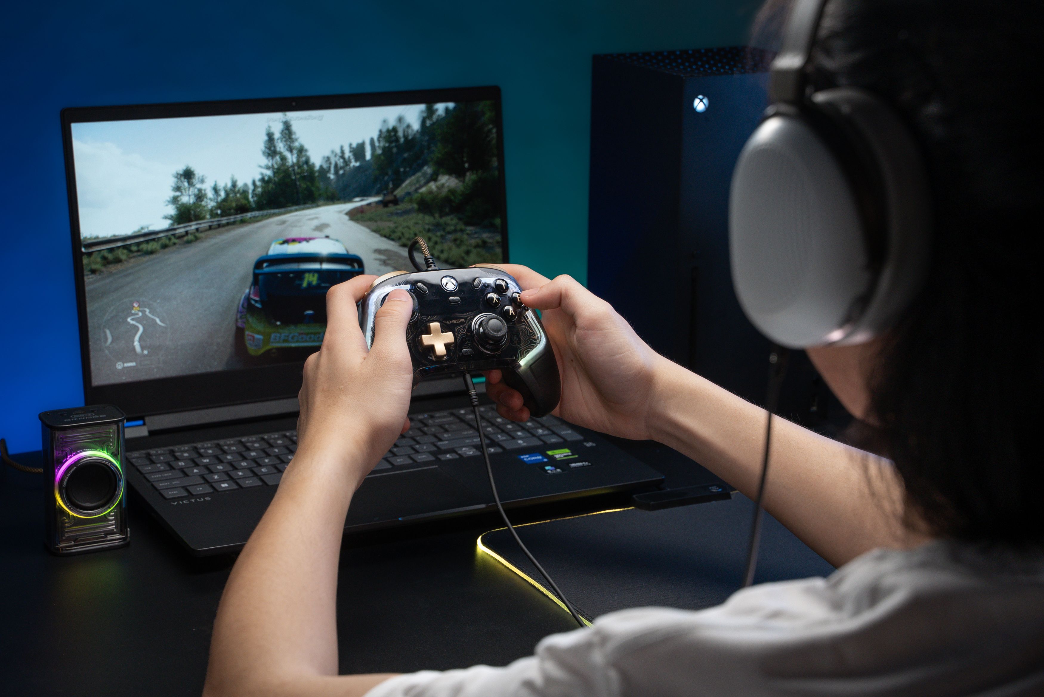 An image of the GameSir Kaleid Flex in a person's hand playing a racing video game.
