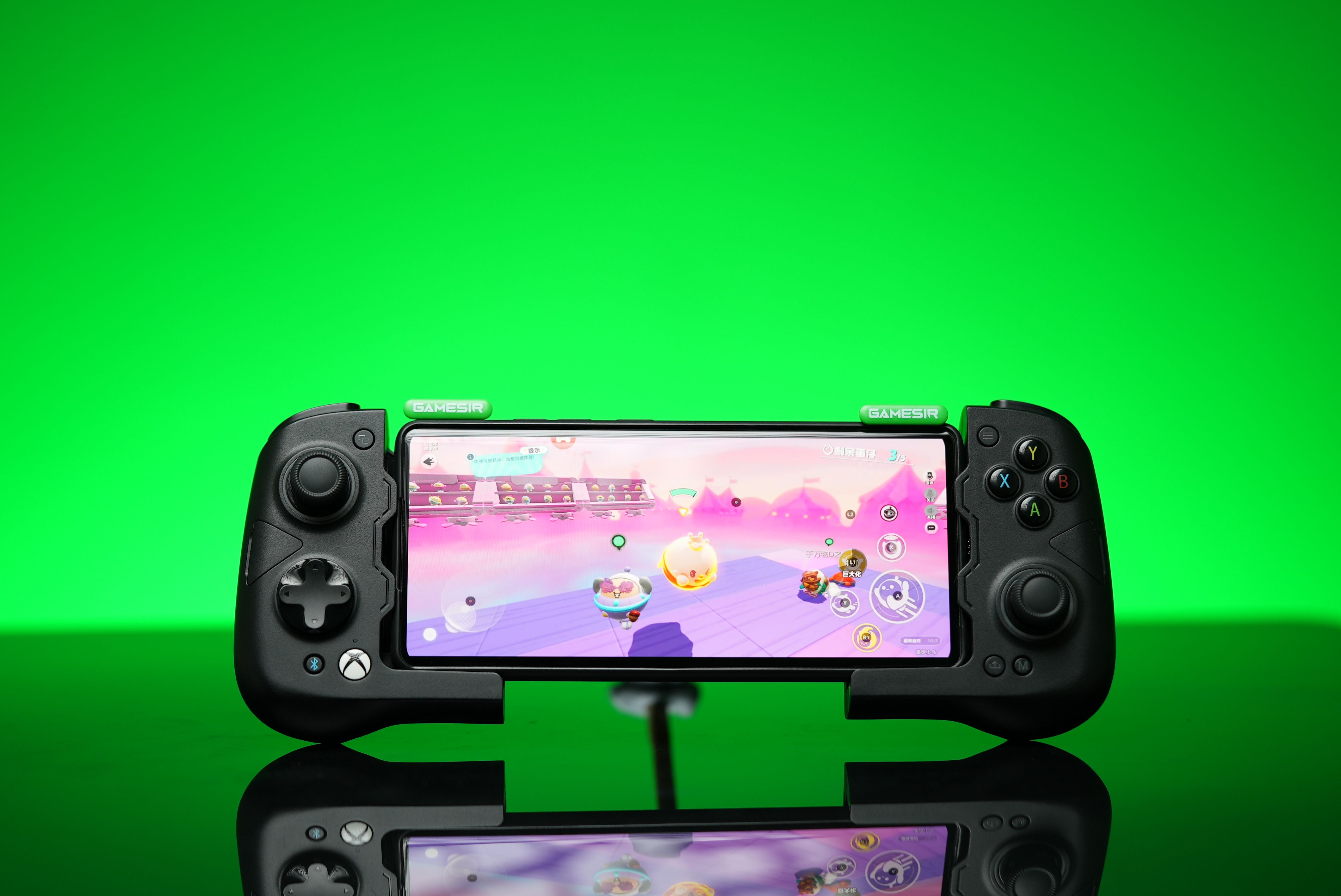 GameSir X4 Aileron and phone with green background