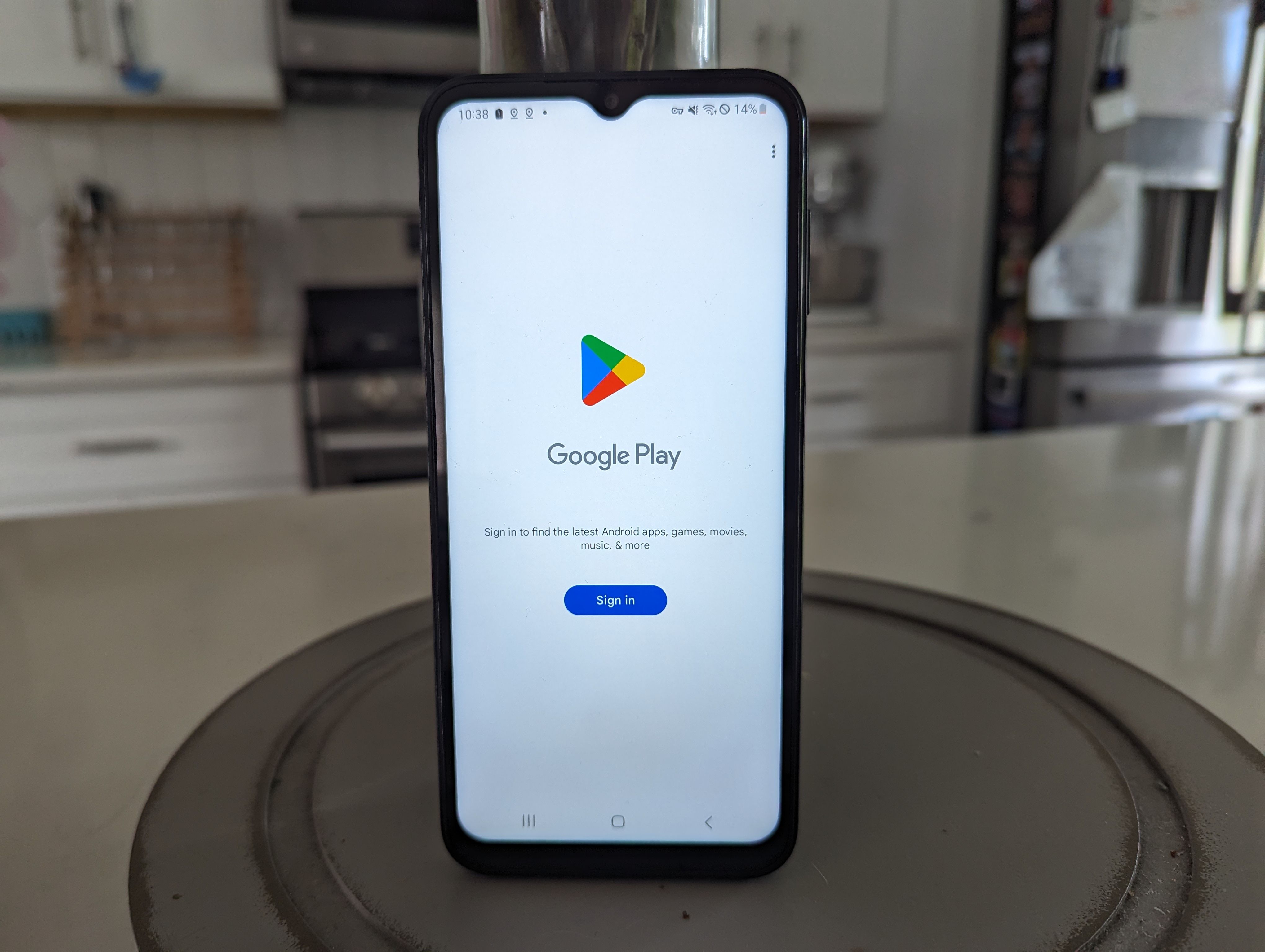 Pinwheel Plus phone with the Google Play Store on the screen on a kitchen counter